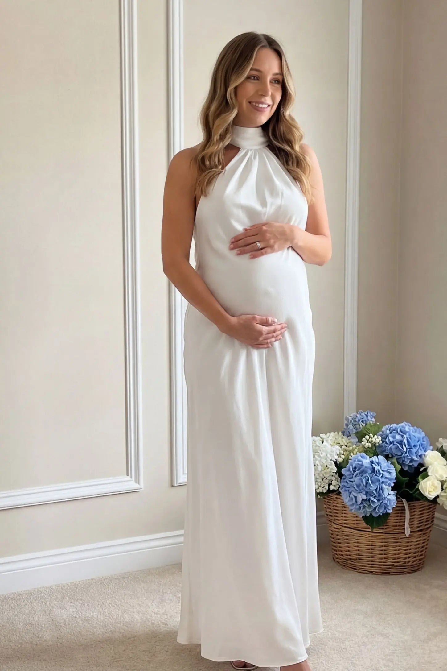 High-Shine Halter Sleeveless Maternity Maxi Dress High-Shine Halter Sleeveless Maternity Maxi Dress in White featuring a bridal-inspired glow on a pregnant model outdoors.