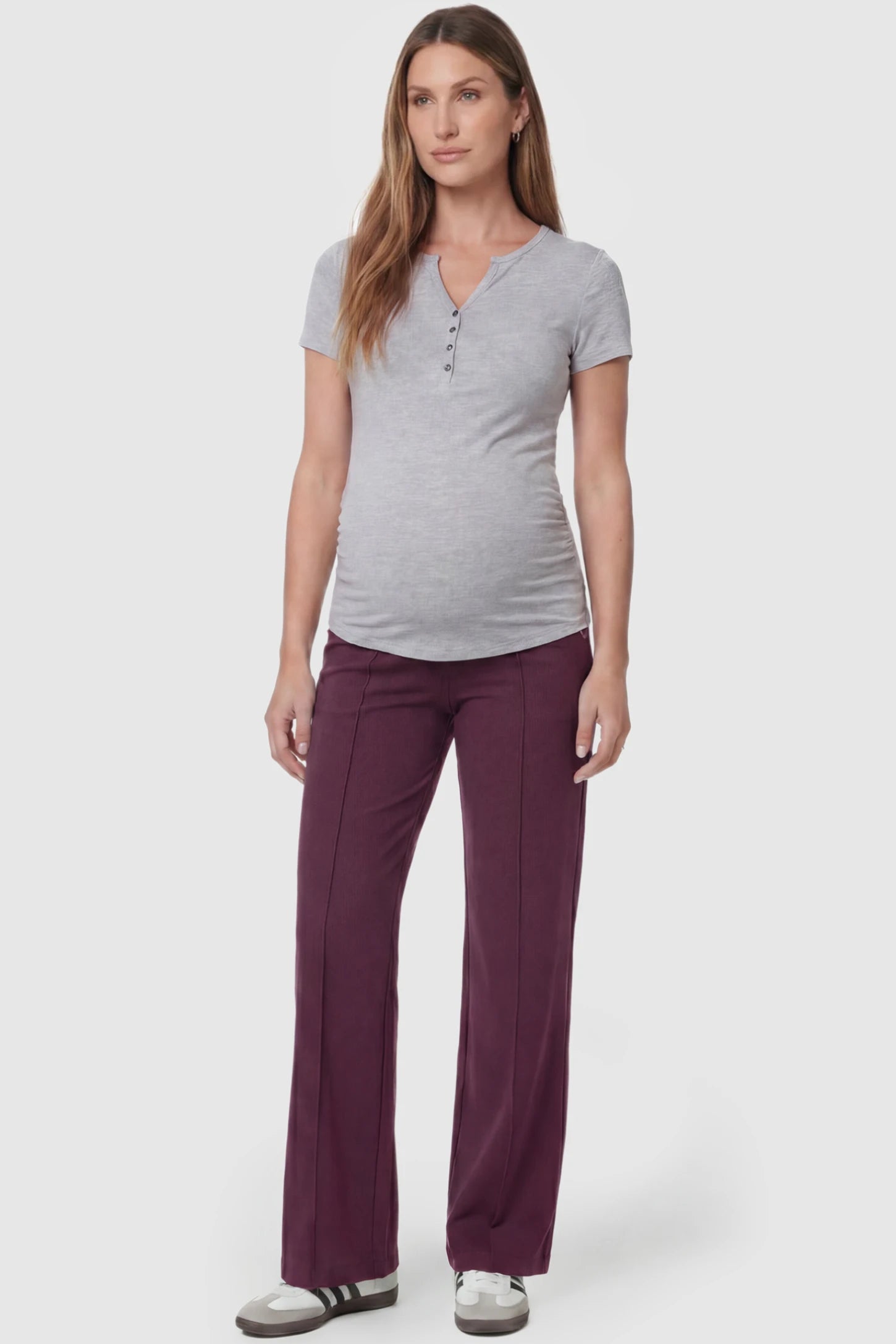 High-Stretch Wide Leg Pocketed Maternity Pants in Burgundy featuring a seamless over-the-bump panel and side pocket on a pregnant model, full body view.