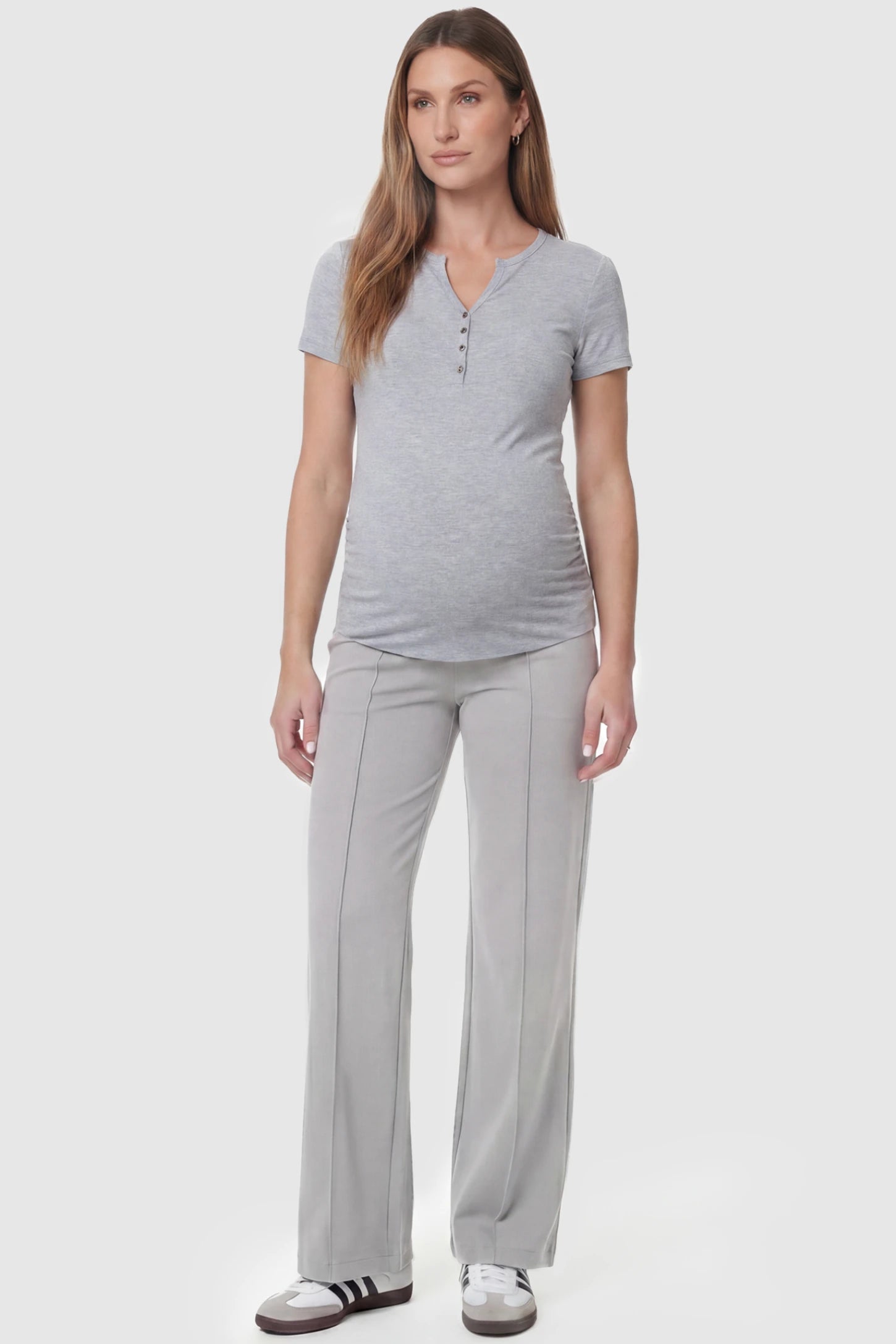 High Stretch Wide Leg Pocketed Maternity Pants High-Stretch Wide Leg Pocketed Maternity Pants in Light Gray featuring a seamless over-the-bump panel and side pocket on a pregnant model, full body view.