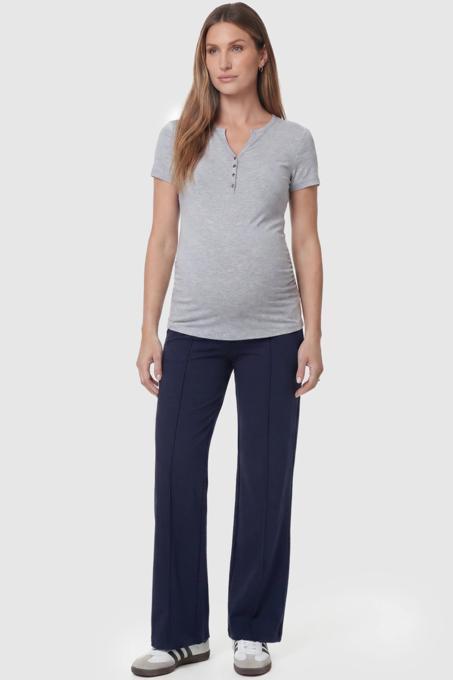 High Stretch Wide Leg Pocketed Maternity Pants High-Stretch Wide Leg Pocketed Maternity Pants in Navy Blue featuring a seamless over-the-bump panel and side pocket on a pregnant model, full body view.