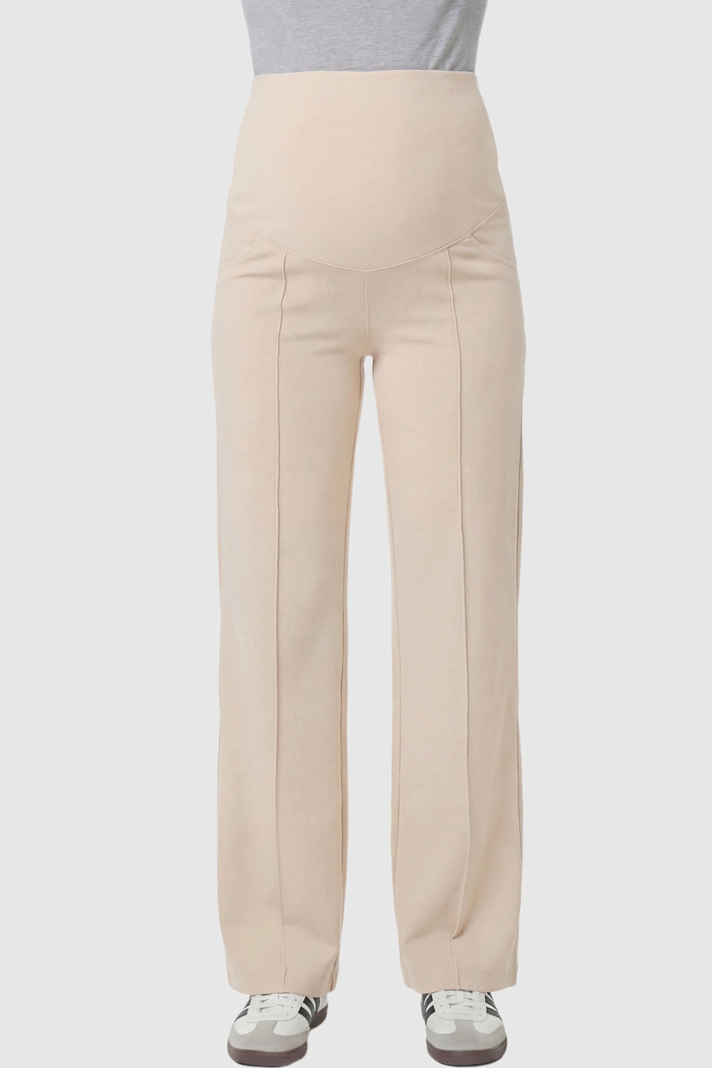 High Stretch Wide Leg Pocketed Maternity Pants High-Stretch Wide Leg Pocketed Maternity Pants in Off White featuring a seamless over-the-bump panel and side pocket on a pregnant model showing front.