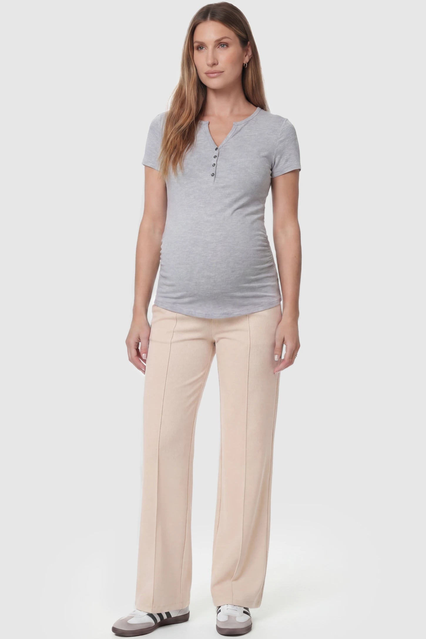 High Stretch Wide Leg Pocketed Maternity Pants High-Stretch Wide Leg Pocketed Maternity Pants in Off White featuring a seamless over-the-bump panel and side pocket on a pregnant model, full body view.