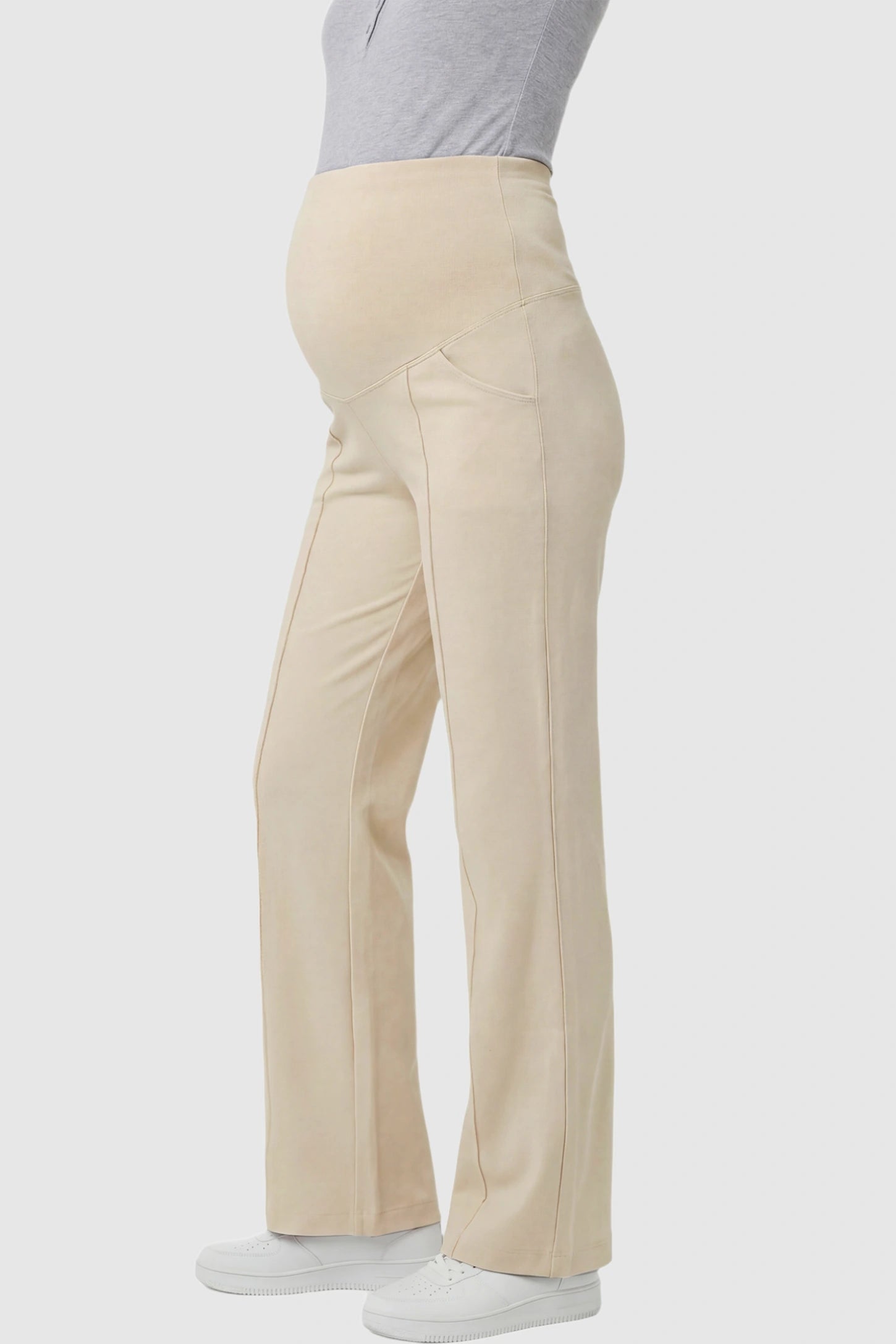 High Stretch Wide Leg Pocketed Maternity Pants High-Stretch Wide Leg Pocketed Maternity Pants in Off White featuring a seamless over-the-bump panel and side pocket on a pregnant model showing side.