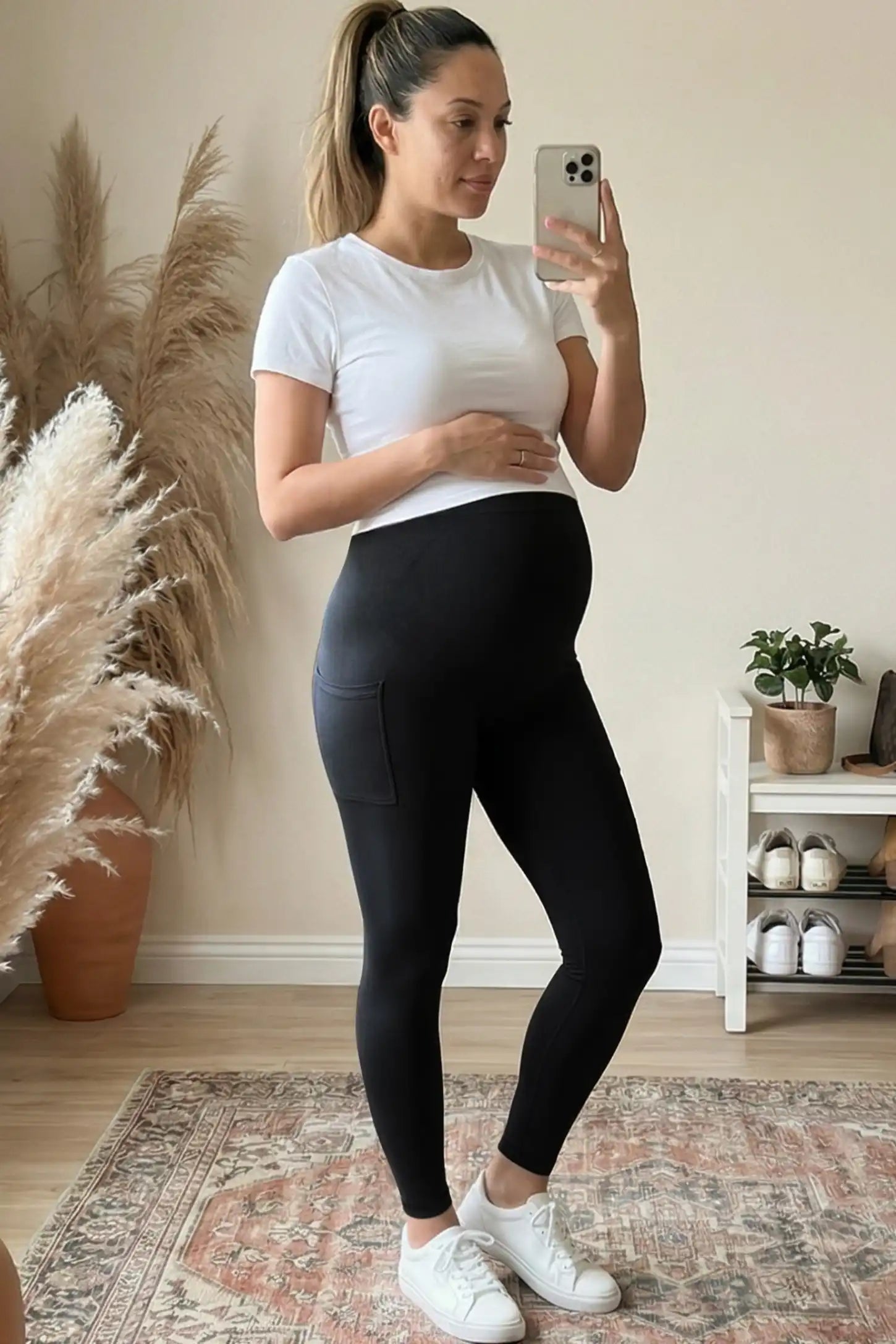High Waist Ankle Length Pocketed Maternity Leggings High-Waist Ankle-Length Pocketed Maternity Leggings in Black featuring a seamless waistband on a pregnant woman.