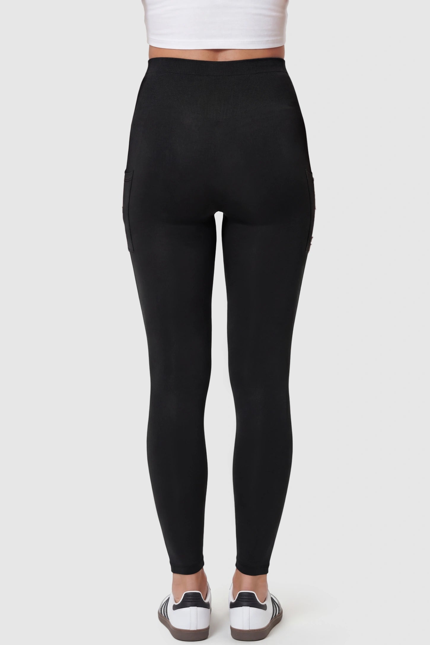 High Waist Ankle Length Pocketed Maternity Leggings High-Waist Ankle-Length Pocketed Maternity Leggings in Black featuring soft breathable fabric on a pregnant model, back view.