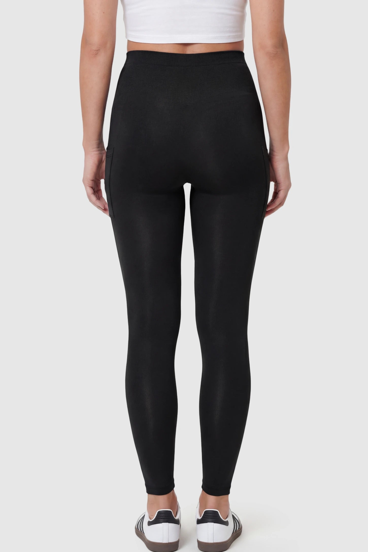 High Waist Ankle Length Pocketed Maternity Leggings High-Waist Ankle-Length Pocketed Maternity Leggings in Black featuring soft breathable fabric on a pregnant model showing back.