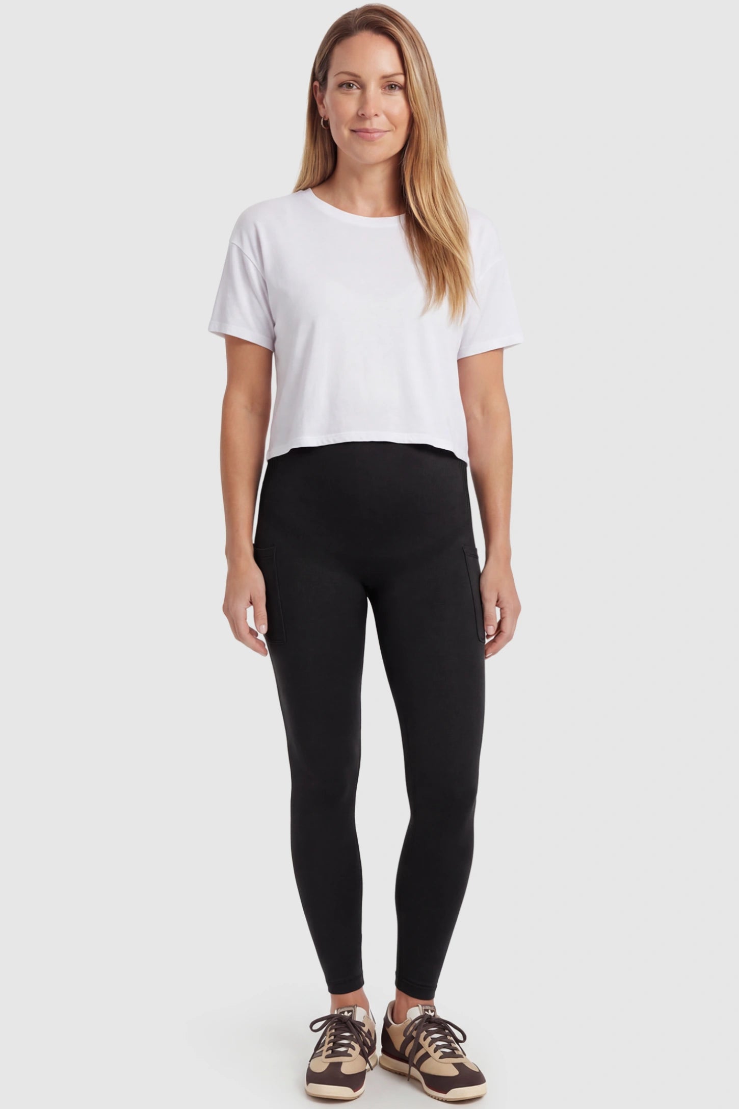 High Waist Ankle Length Pocketed Maternity Leggings High-Waist Ankle-Length Pocketed Maternity Leggings in Black featuring a seamless waistband on a postpartum model, front view.
