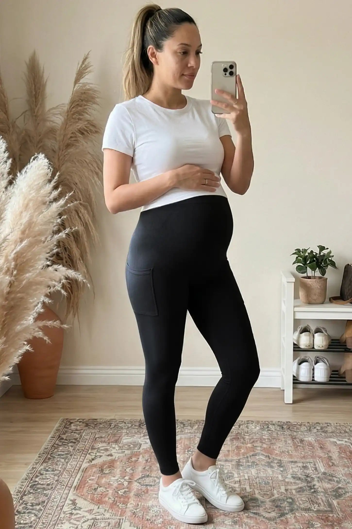 High Waist Ankle Length Pocketed Maternity Leggings High-Waist Ankle-Length Pocketed Maternity Leggings in Black featuring a seamless waistband on a pregnant woman, front view.