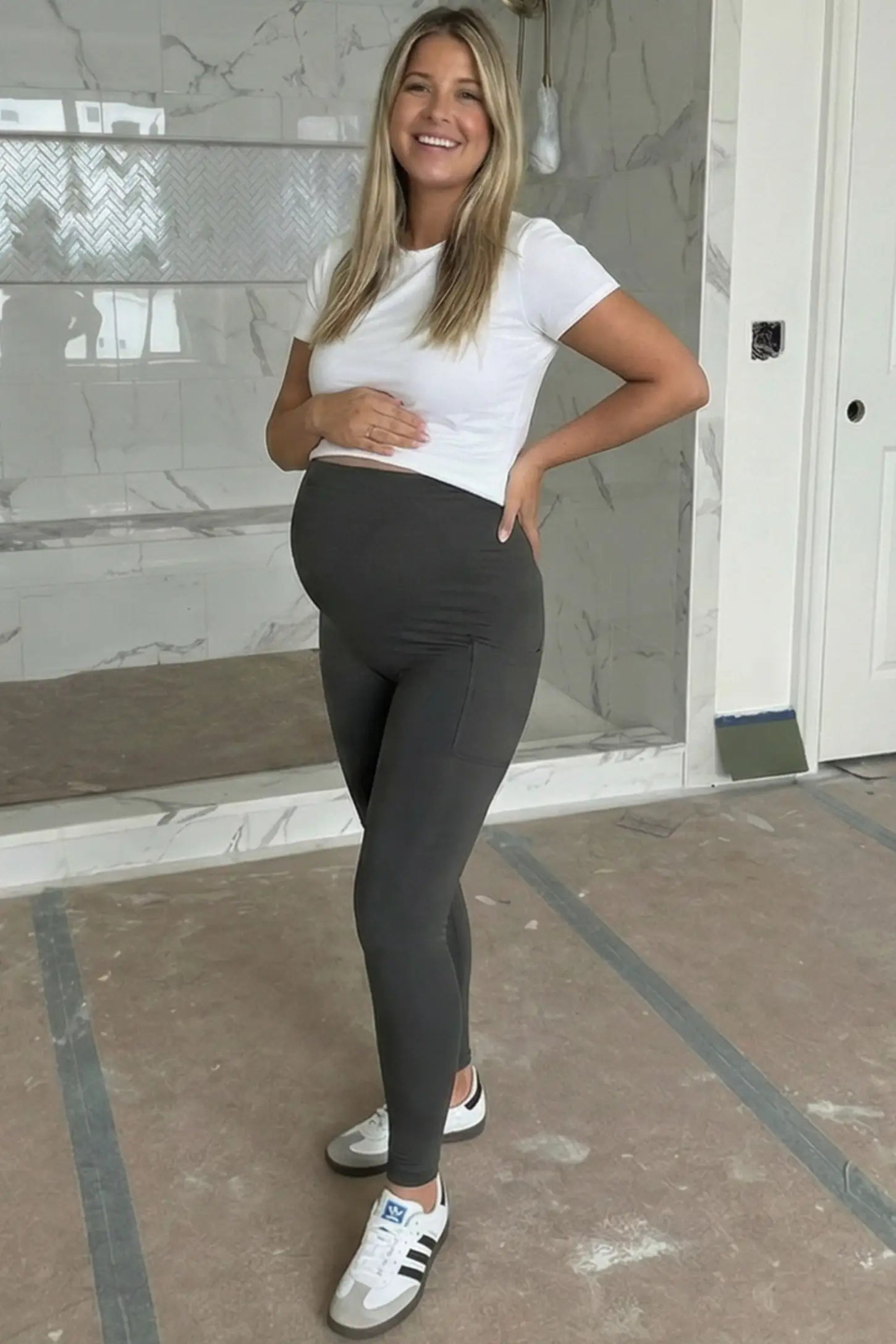 High Waist Ankle Length Pocketed Maternity Leggings High-Waist Ankle-Length Pocketed Maternity Leggings in Gray featuring a seamless waistband on a pregnant woman, front view.