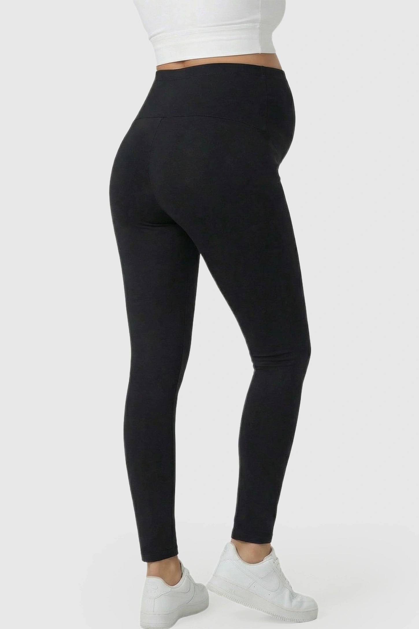 High Waist Belly Support Full Length Maternity Leggings High Waist Belly Support Full Length Maternity Leggings in black featuring molding waistband on a pregnant model showing back.