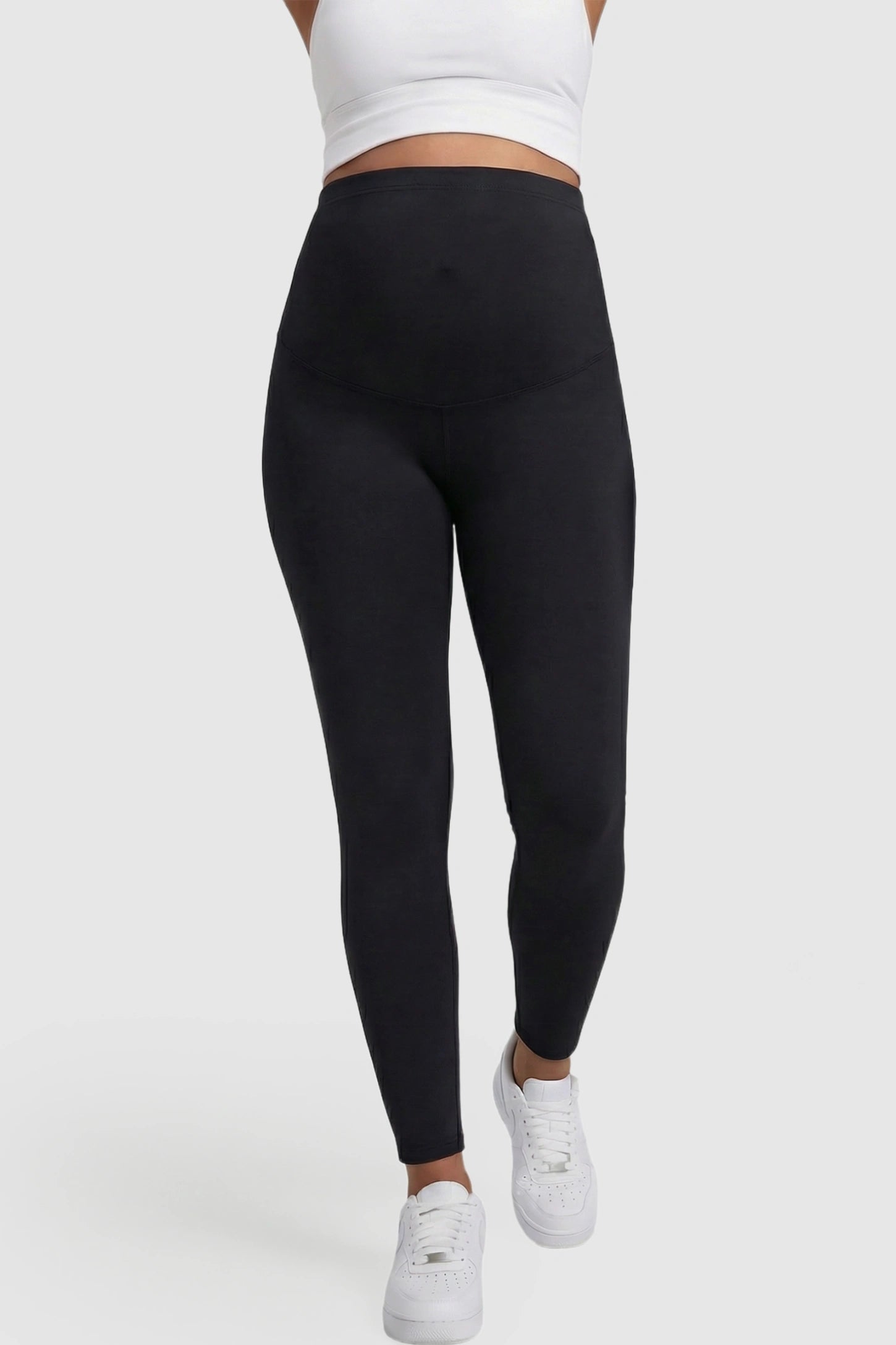 High Waist Belly Support Full Length Maternity Leggings High Waist Belly Support Full Length Maternity Leggings in black featuring molding waistband on a pregnant model showing front.