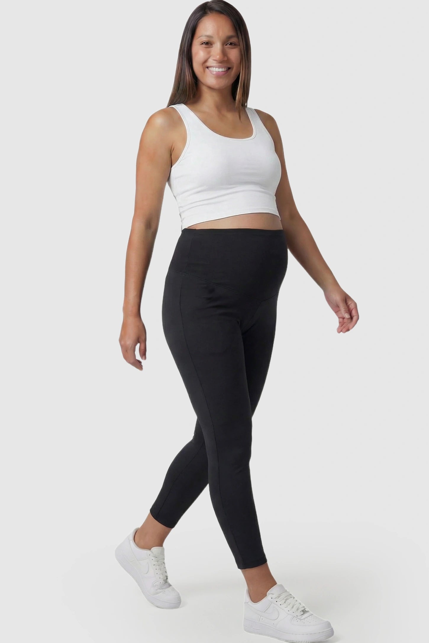 High Waist Belly Support Full Length Maternity Leggings High Waist Belly Support Full Length Maternity Leggings in black featuring molding waistband on a pregnant model posing front.