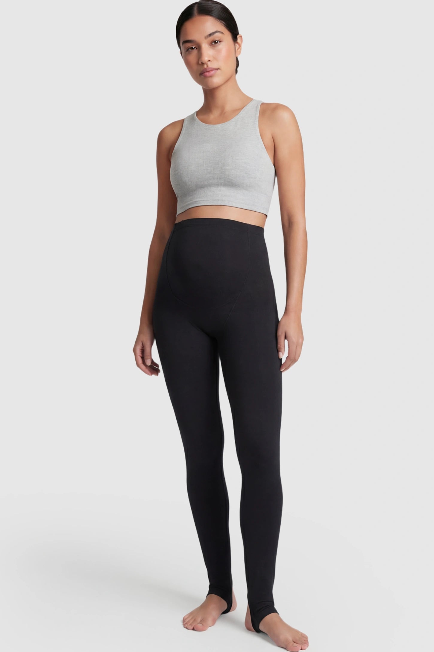High Waist Fleece-Lined Stirrup Maternity Leggings High Waist Fleece-Lined Stirrup Maternity Leggings in Black featuring a supportive over-the-belly panel on a postpartum model showing front.
