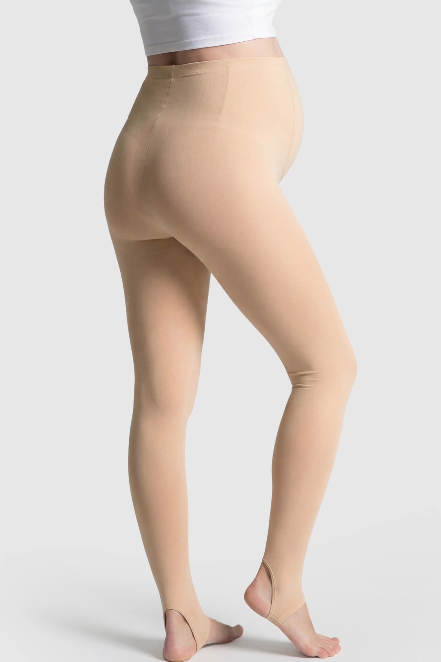 High Waist Fleece-Lined Stirrup Maternity Leggings High Waist Fleece-Lined Stirrup Maternity Leggings in Skin Tone featuring a Stirrup design on a pregnant model showing back.