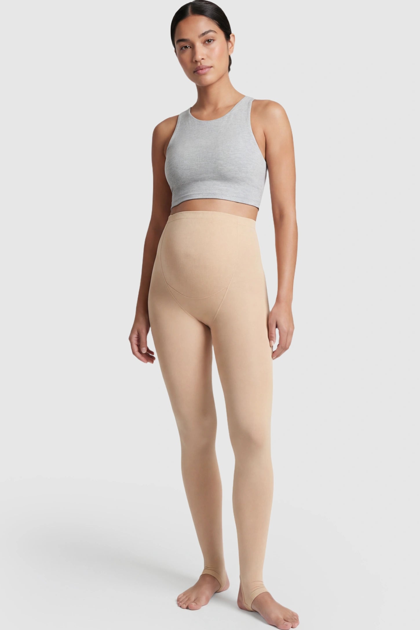 High Waist Fleece-Lined Stirrup Maternity Leggings High Waist Fleece-Lined Stirrup Maternity Leggings in Skin Tone featuring a supportive over-the-belly panel on a postpartum model showing front.