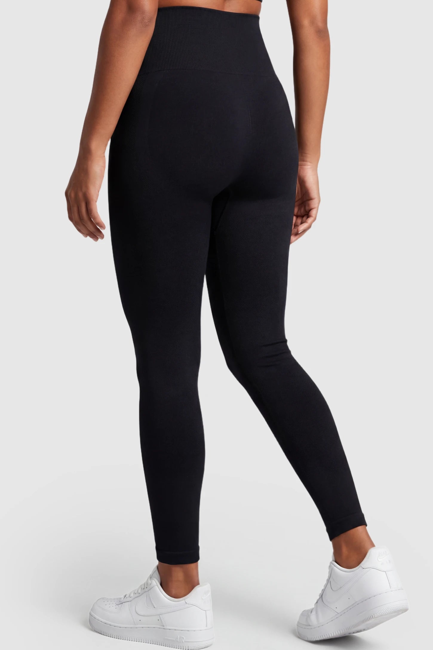 High Waist Full Length Maternity Leggings High Waist Seamless Full-Length Maternity Leggings in Black featuring high waist on a pregnant model showing back.