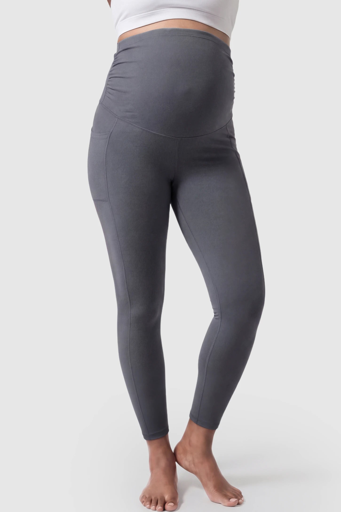 High Waist Full Panel Pocketed Maternity Leggings High Waist Full Panel Maternity Leggings in Dark Gray featuring side pockets on a pregnant model showing front.