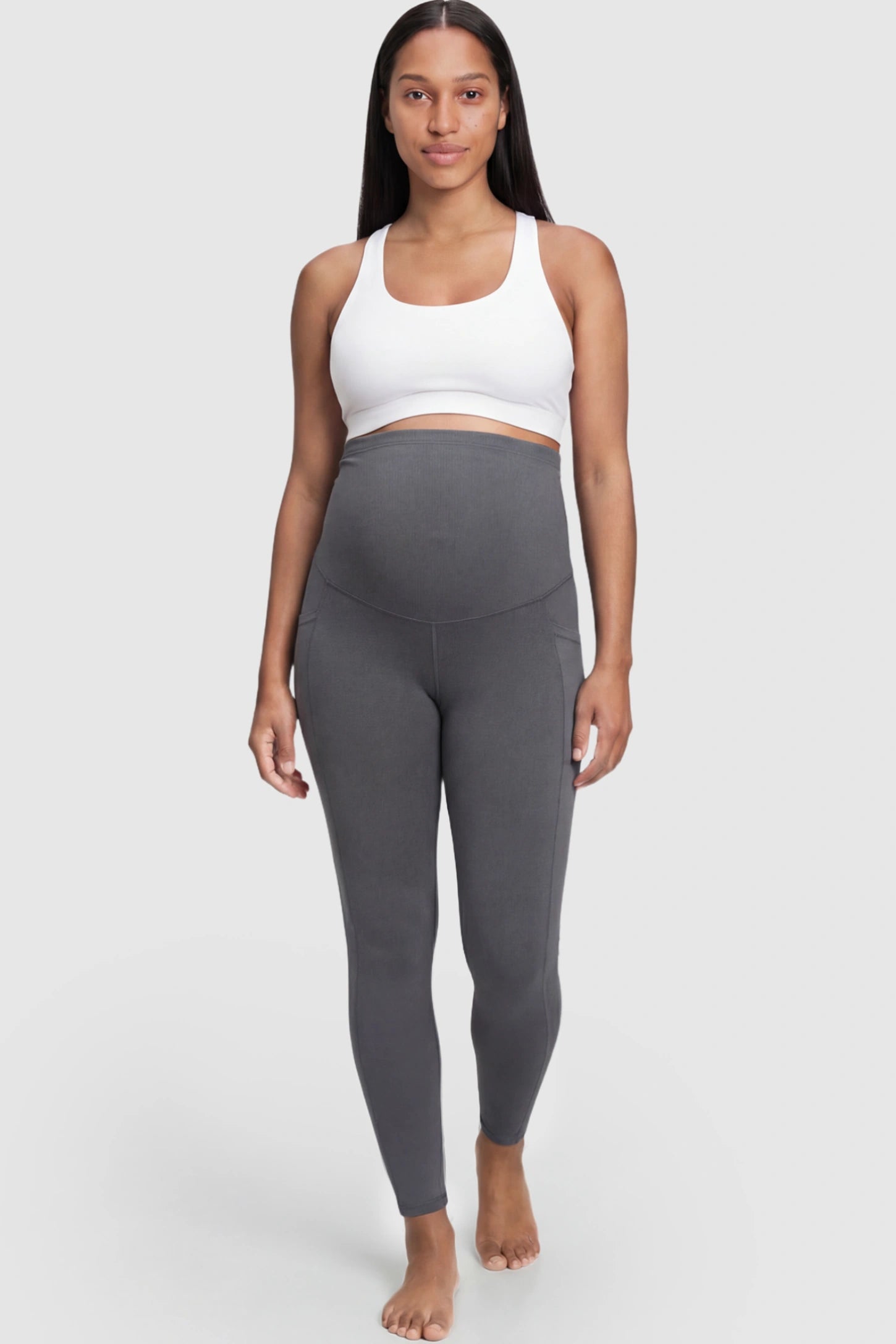 High Waist Full Panel Pocketed Maternity Leggings High Waist Full Panel Maternity Leggings in Dark Gray featuring side pockets on a pregnant model.