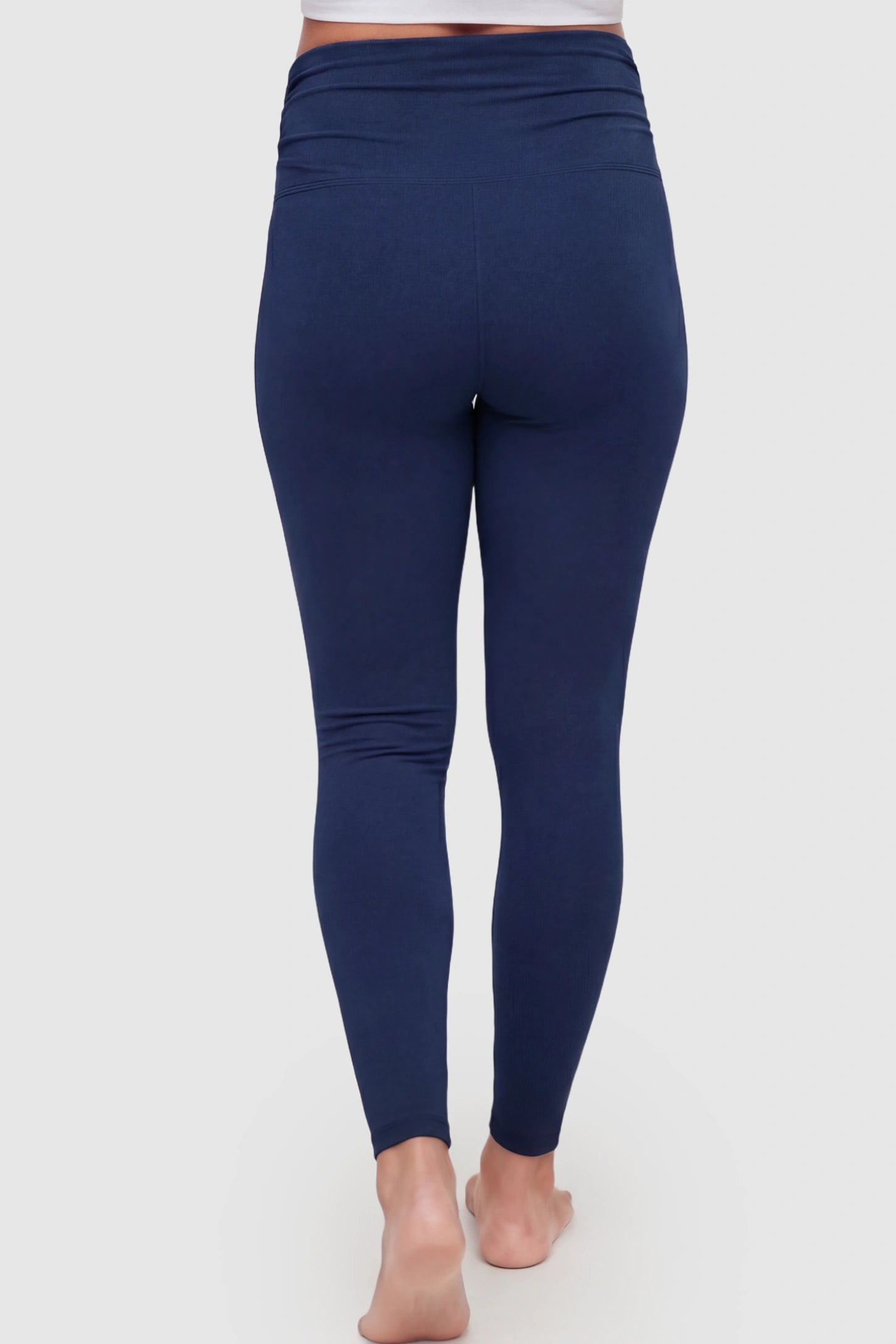 High Waist Full Panel Pocketed Maternity Leggings High Waist Full Panel Maternity Leggings in Navy Blue featuring side pockets on a pregnant model showing back.