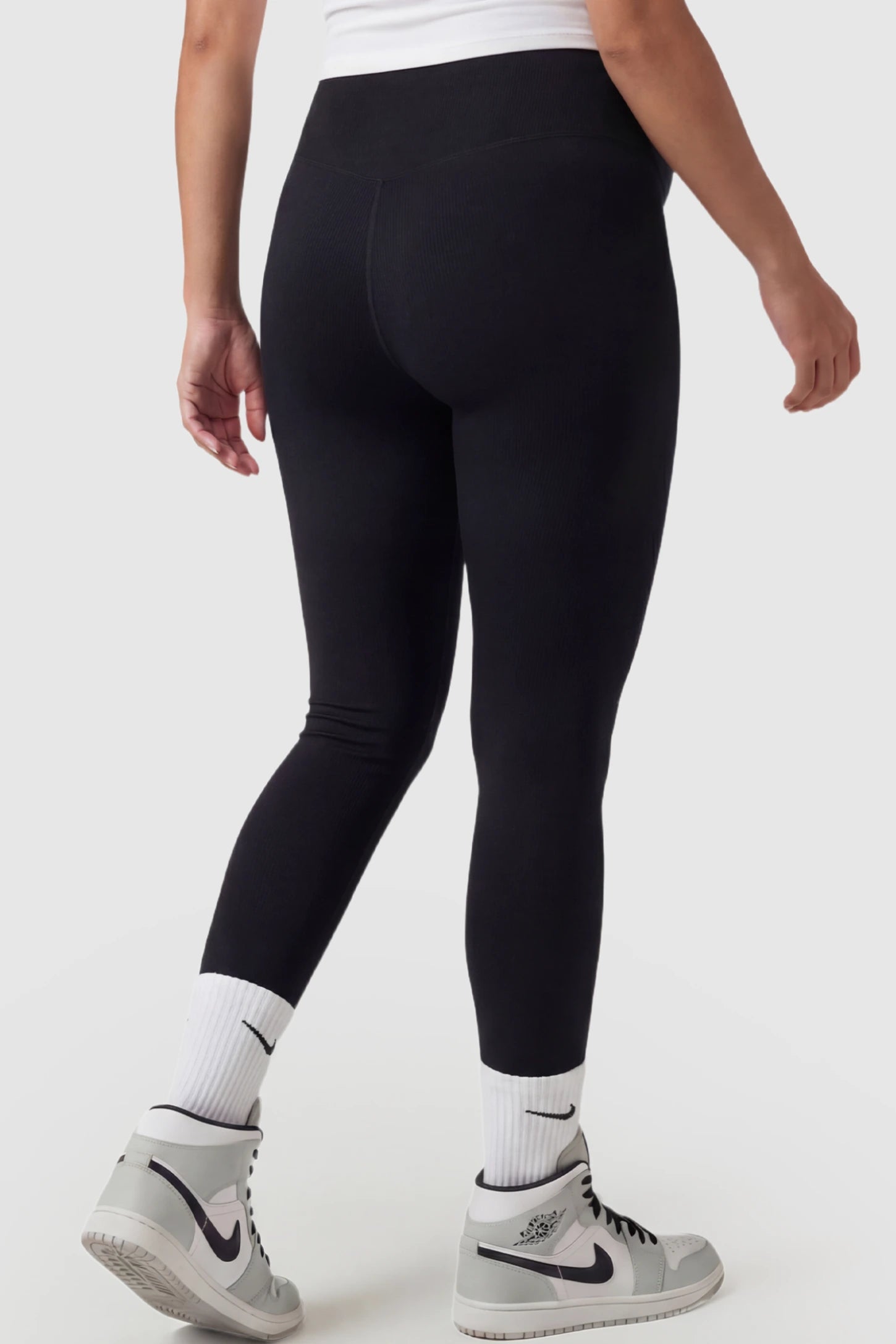 High Waist Slim Fit Maternity Leggings High Waist Slim Fit Maternity Leggings in Black featuring slim fit on a pregnant model back view.