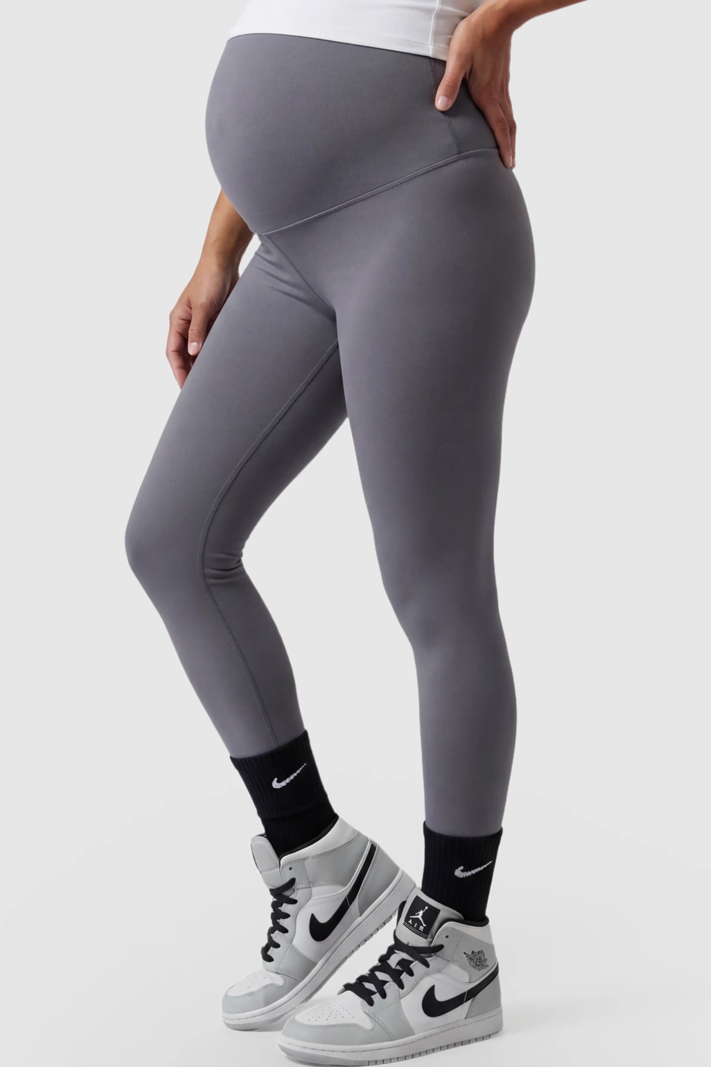 High Waist Slim Fit Maternity Leggings High Waist Slim Fit Maternity Leggings in Gray featuring a seamless full-panel on a pregnant model side view.