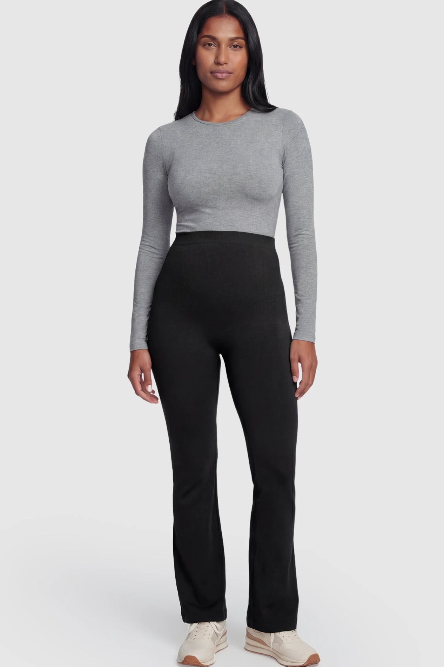High Waisted Flare Leg Maternity Pants High Waisted Flare Leg Maternity Pants in black featuring a flexible over-the-belly support band on a postpartum model.