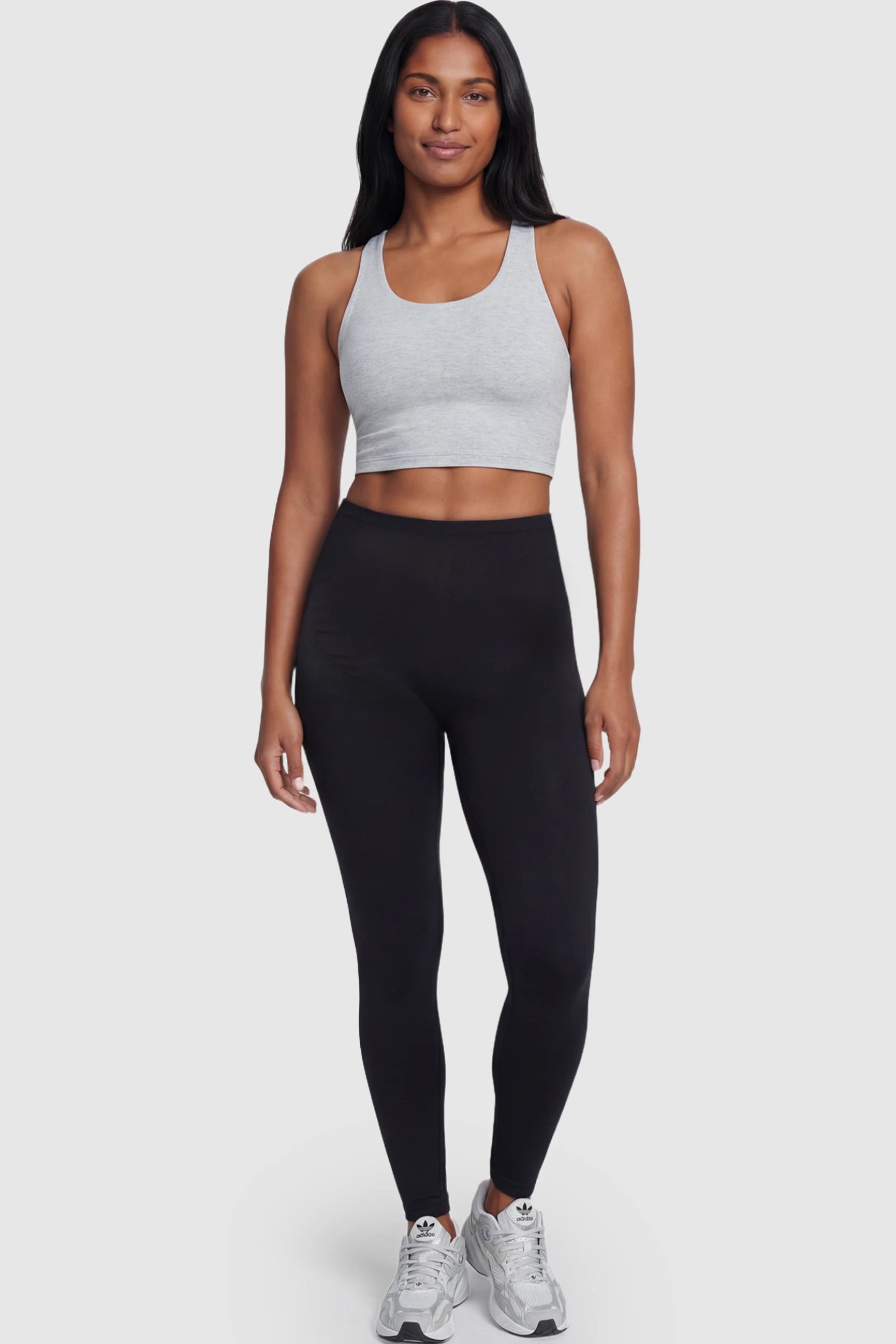 High Waisted Full Length Maternity Leggings High Waisted Full Length Maternity Leggings in Black featuring a seamless over-the-bump band on a postpartum model showing front.