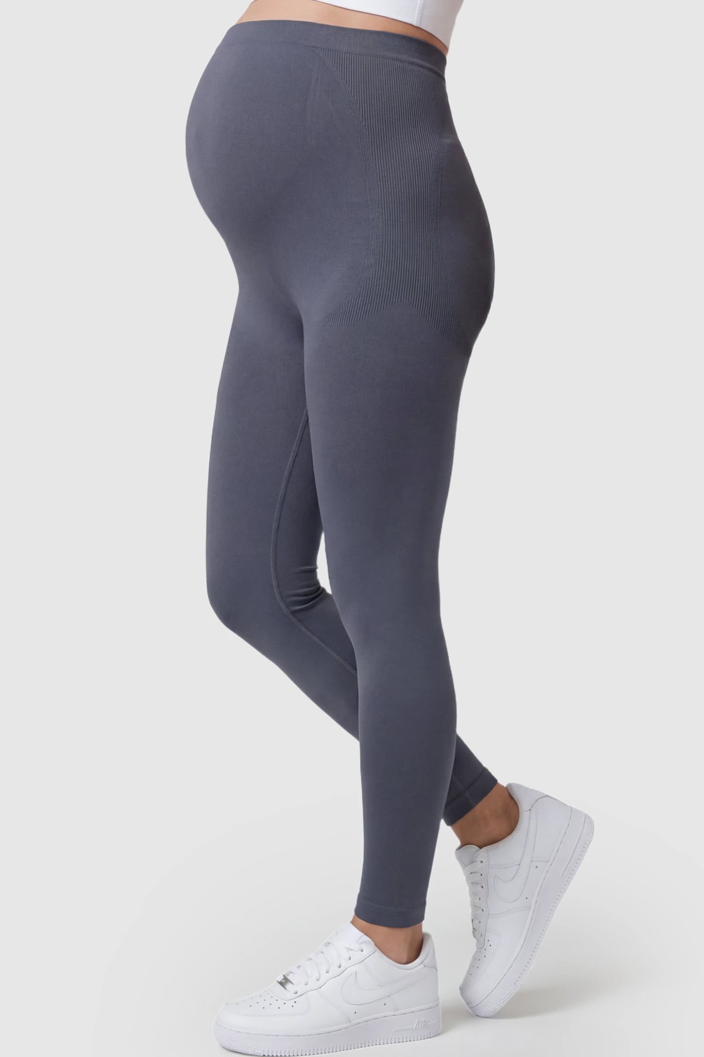 High Waisted Full Length Maternity Leggings High Waisted Full Length Maternity Leggings in Gray featuring a seamless over-the-bump band on a pregnant model showing side.