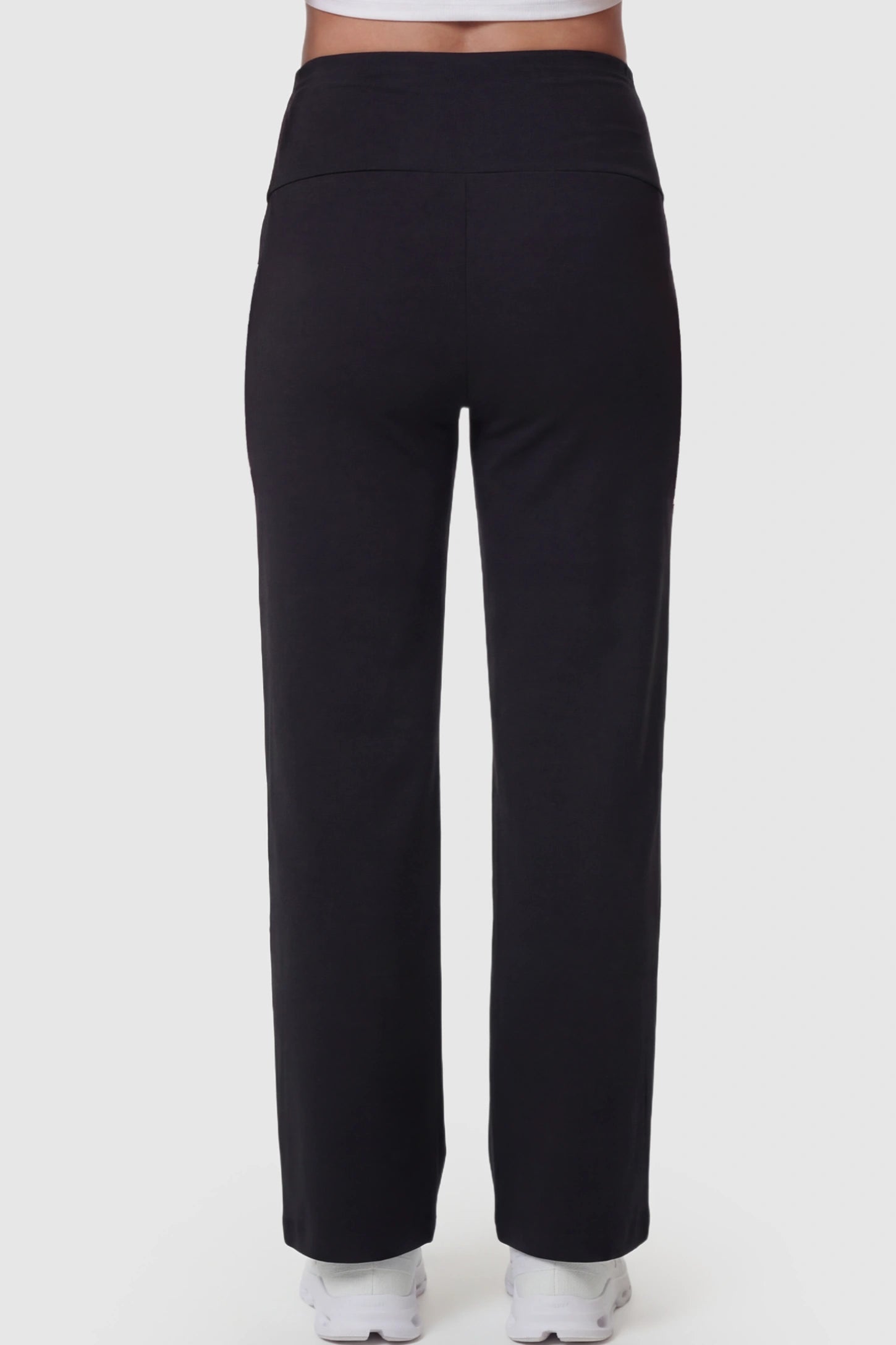 High Waisted Full Panel Wide Leg Maternity Pants High Waisted Full Panel Wide Leg Maternity Pants in Black featuring a stretch waistband on a pregnant model showing back.