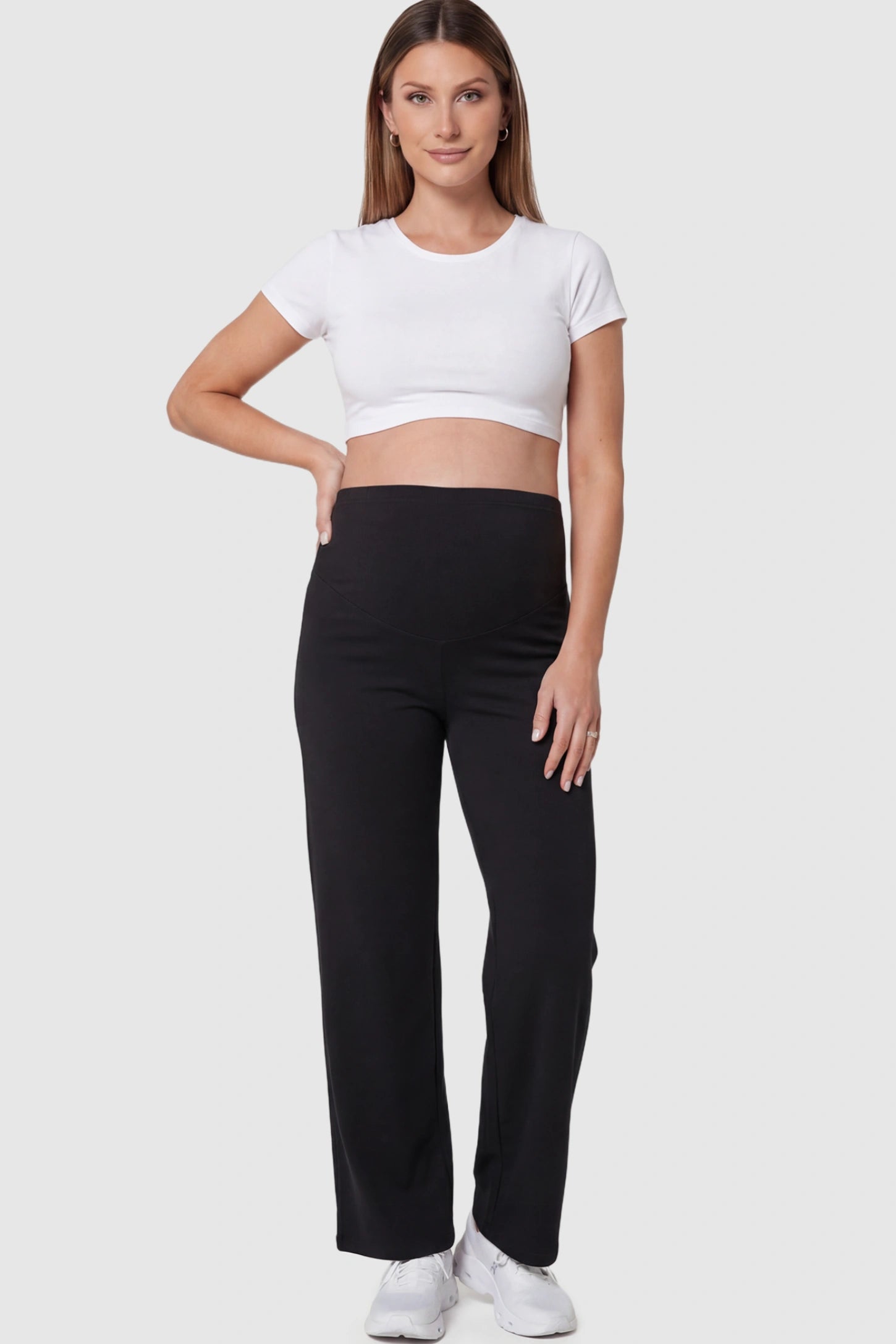 High Waisted Full Panel Wide Leg Maternity Pants in Black featuring a stretch waistband on a pregnant model.