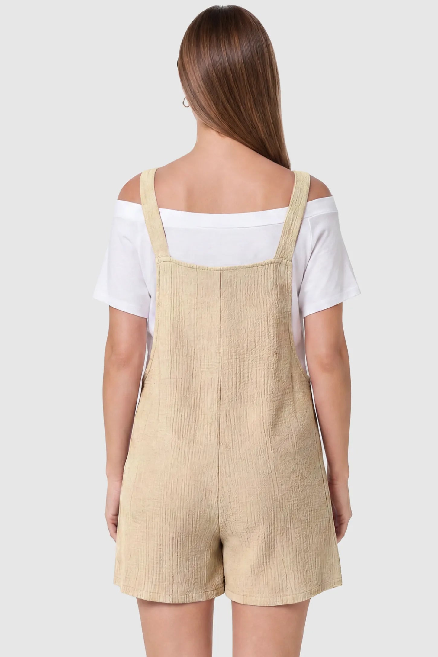 Knot Strap Front Pocket Maternity Romper Knot Strap Front Pocket Maternity Romper in Beige featuring a sleeveless silhouette with wide straps on a model, back view.