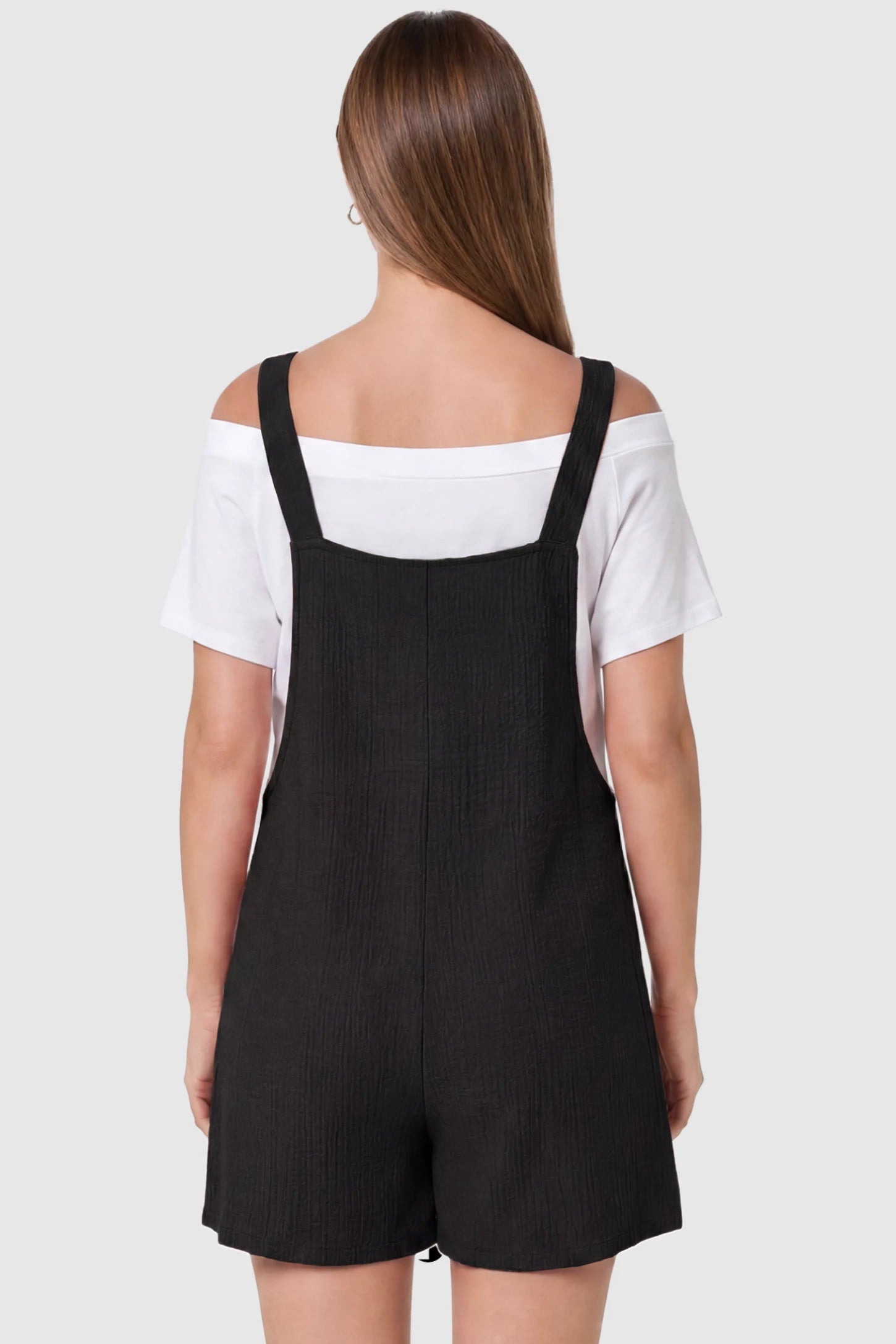 Knot Strap Front Pocket Maternity Romper Knot Strap Front Pocket Maternity Romper in Black featuring a sleeveless silhouette with wide straps on a model, back view.