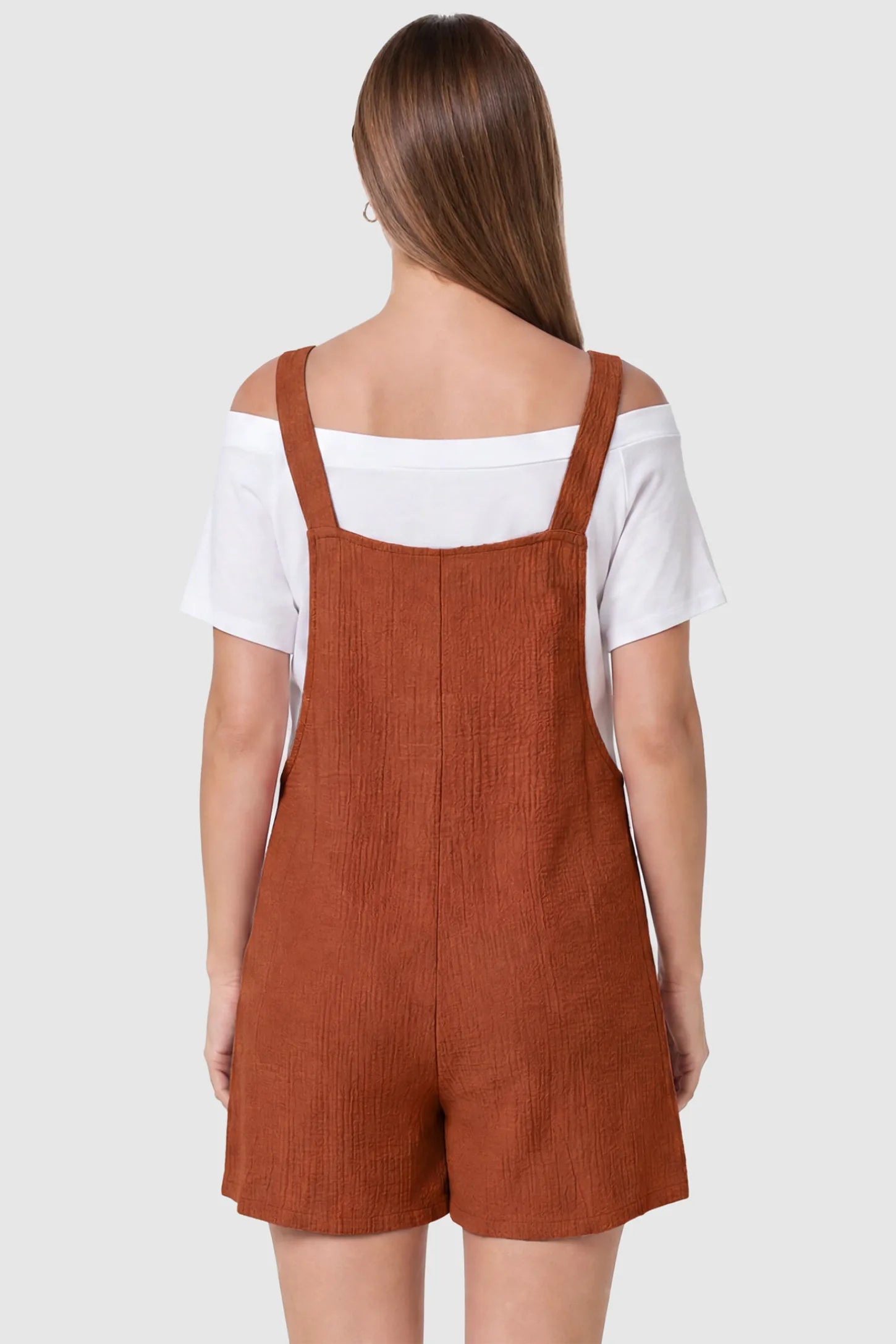 Knot Strap Front Pocket Maternity Romper Knot Strap Front Pocket Maternity Romper in Dark Brown featuring a sleeveless silhouette with wide straps on a model, back view.