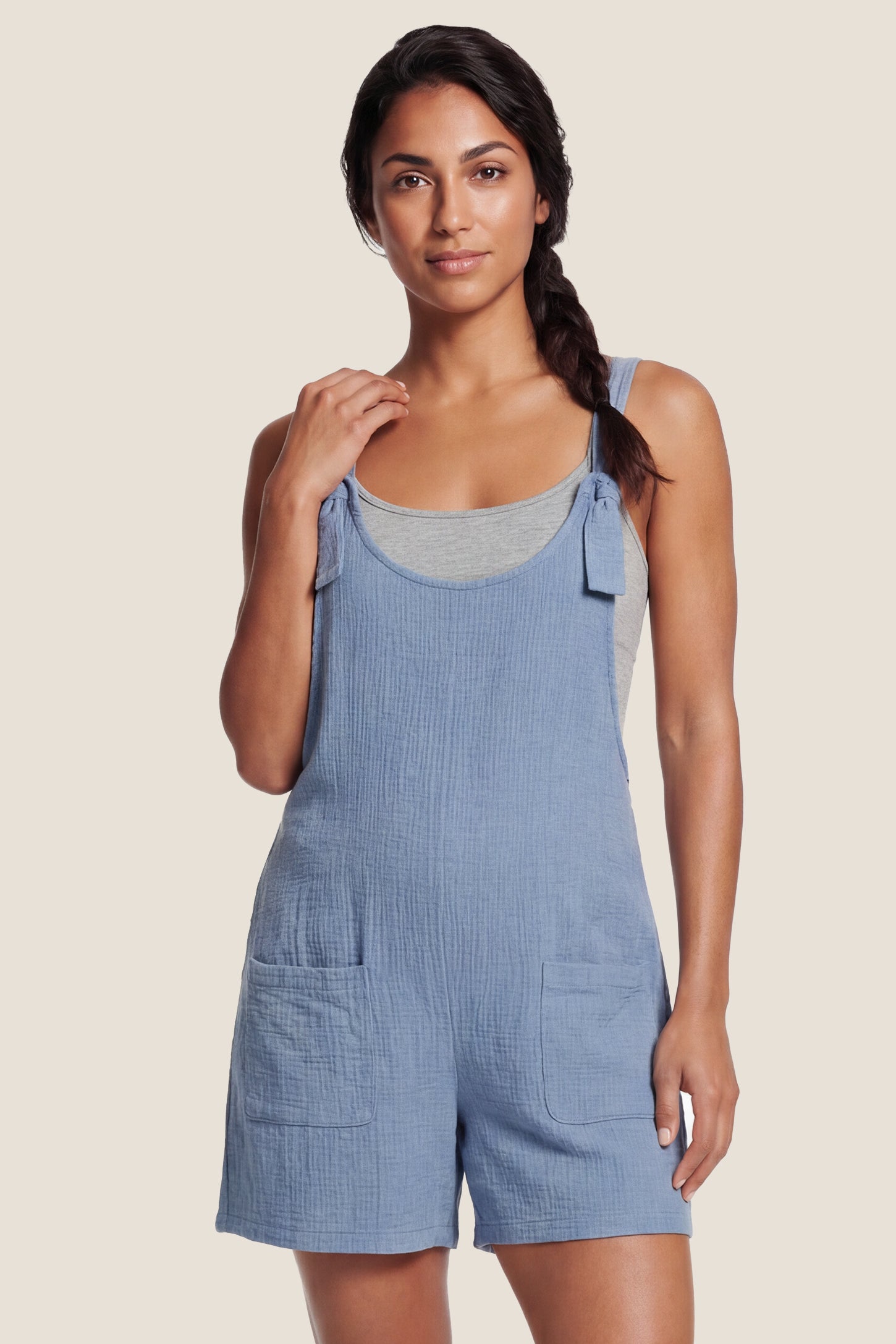 Knot Strap Front Pocket Maternity Romper Knot Strap Front Pocket Maternity Romper in Black featuring deep front pockets and a scoop neck on a postpartum model, front view.