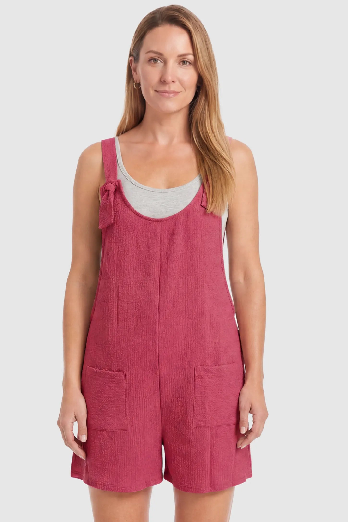 Knot Strap Front Pocket Maternity Romper Knot Strap Front Pocket Maternity Romper in Rose Red featuring deep front pockets and a scoop neck on a postpartum model, front view.