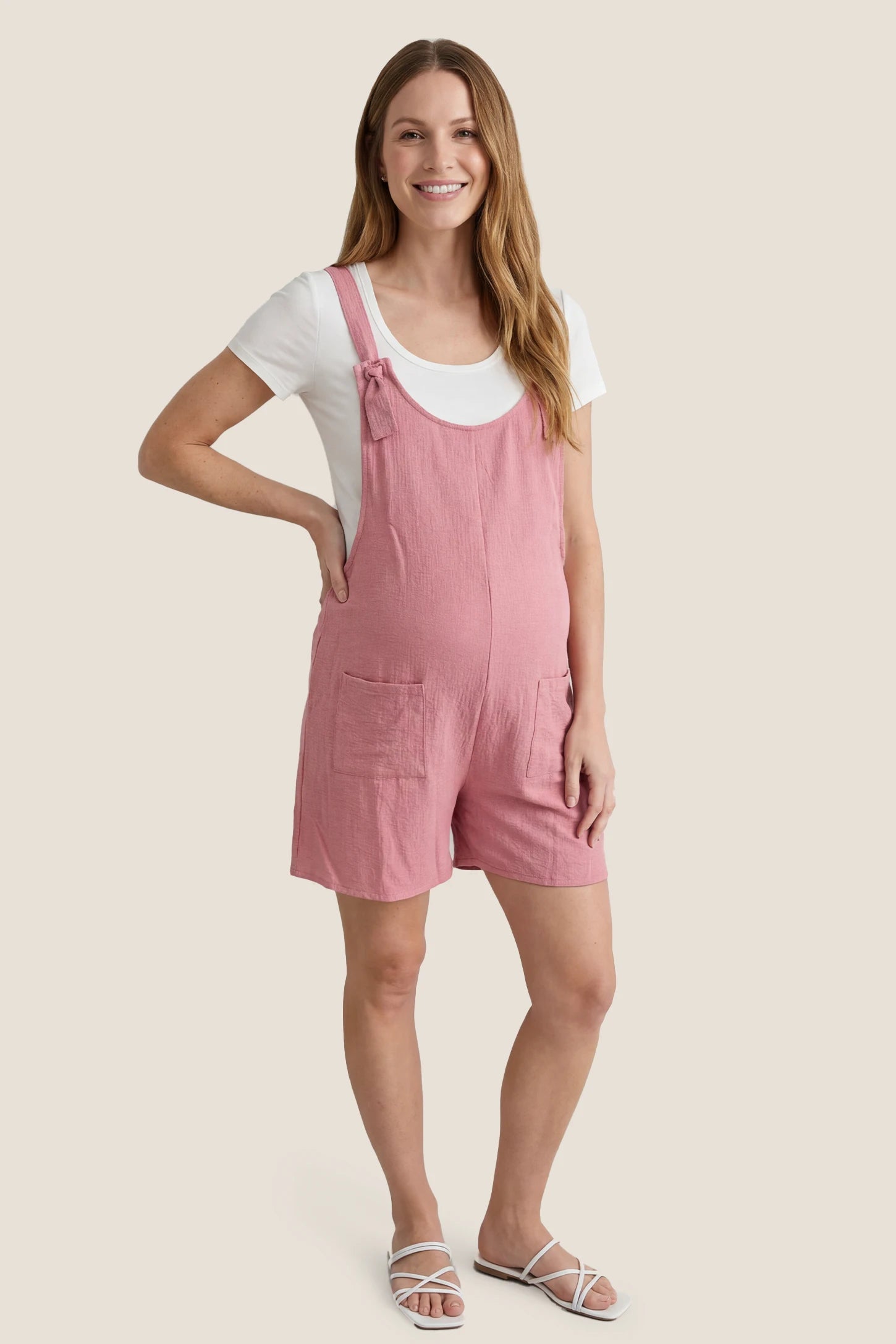Knot Strap Front Pocket Maternity Romper Full body view of the pink Knot Strap Front Pocket Maternity Romper styled for casual everyday maternity wear.