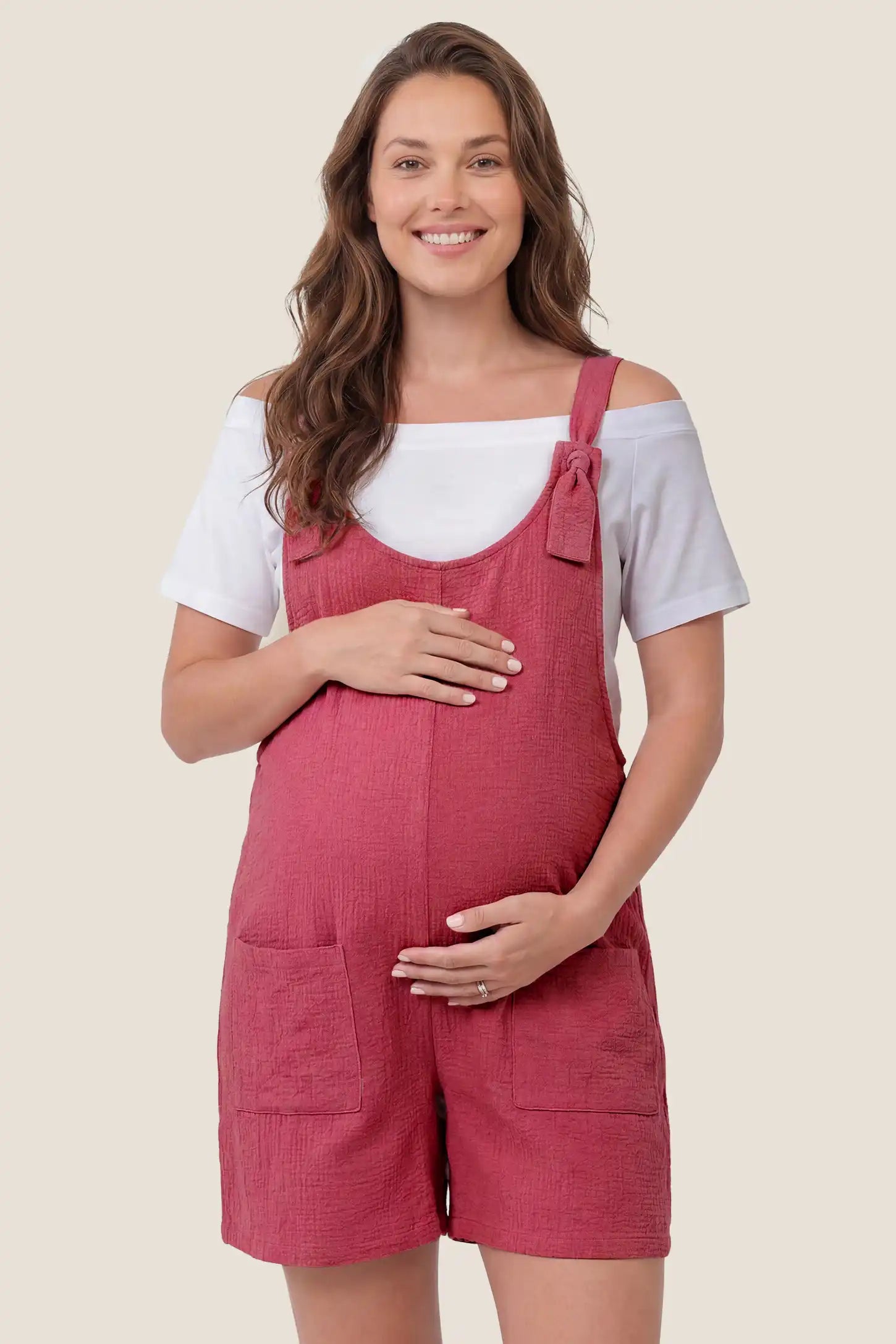 Knot Strap Front Pocket Maternity Romper Front view of the rose red Knot Strap Front Pocket Maternity Romper featuring front pockets and a comfortable maternity fit.