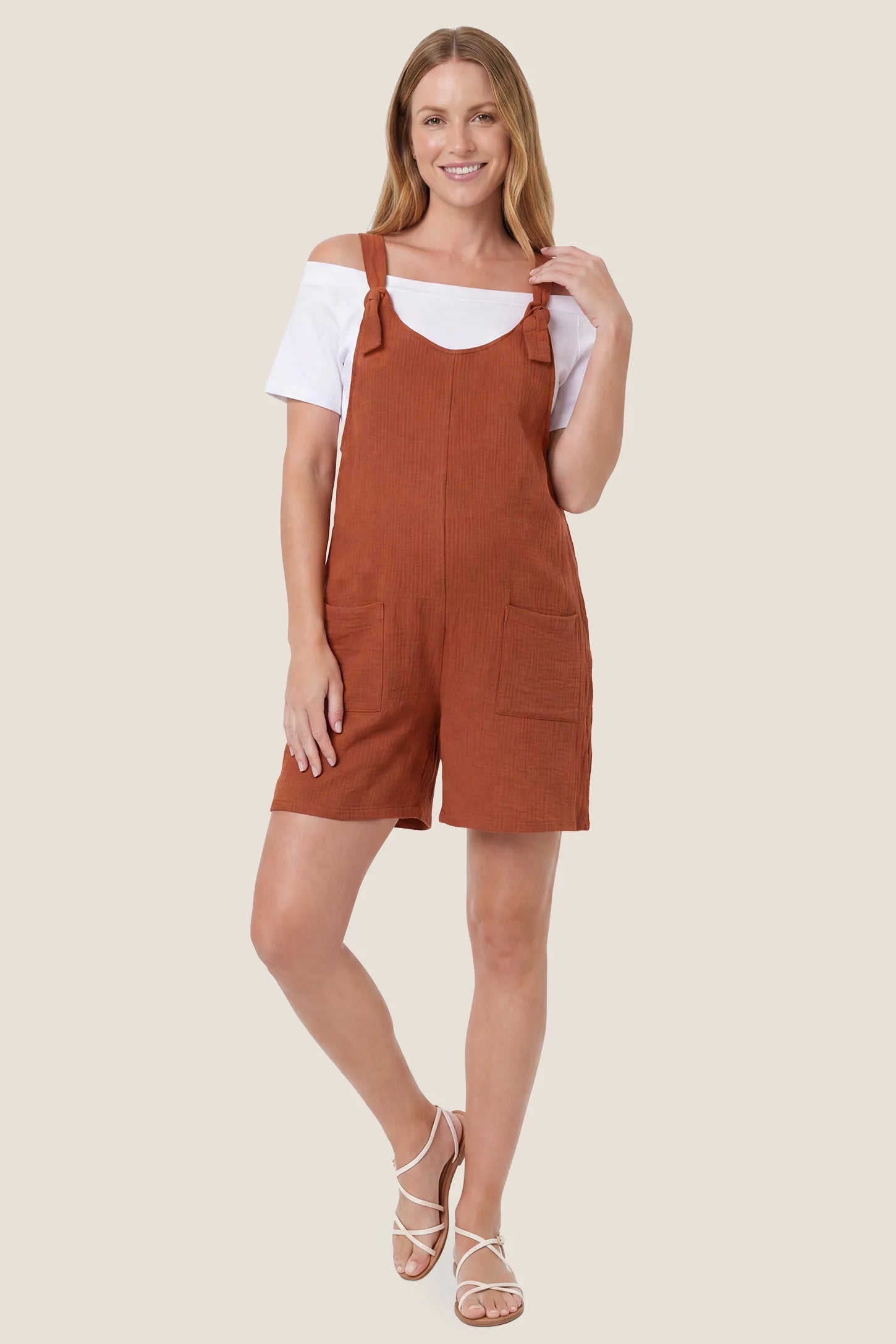Knot Strap Front Pocket Maternity Romper Full body view of the rust Knot Strap Front Pocket Maternity Romper with a comfortable sleeveless silhouette.