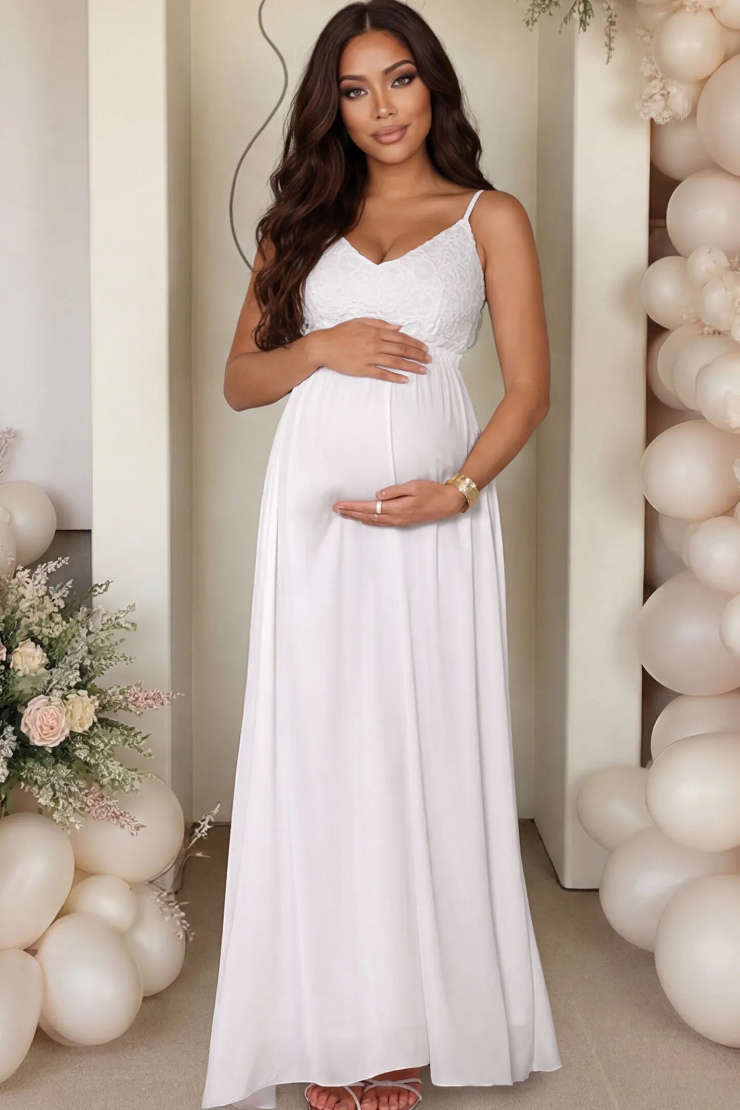 Lace Bodice V-Neck Maternity Maxi Dress Lace Bodice V-Neck Maternity Maxi Dress in White featuring a floral lace overlay and spaghetti straps on a pregnant woman.
