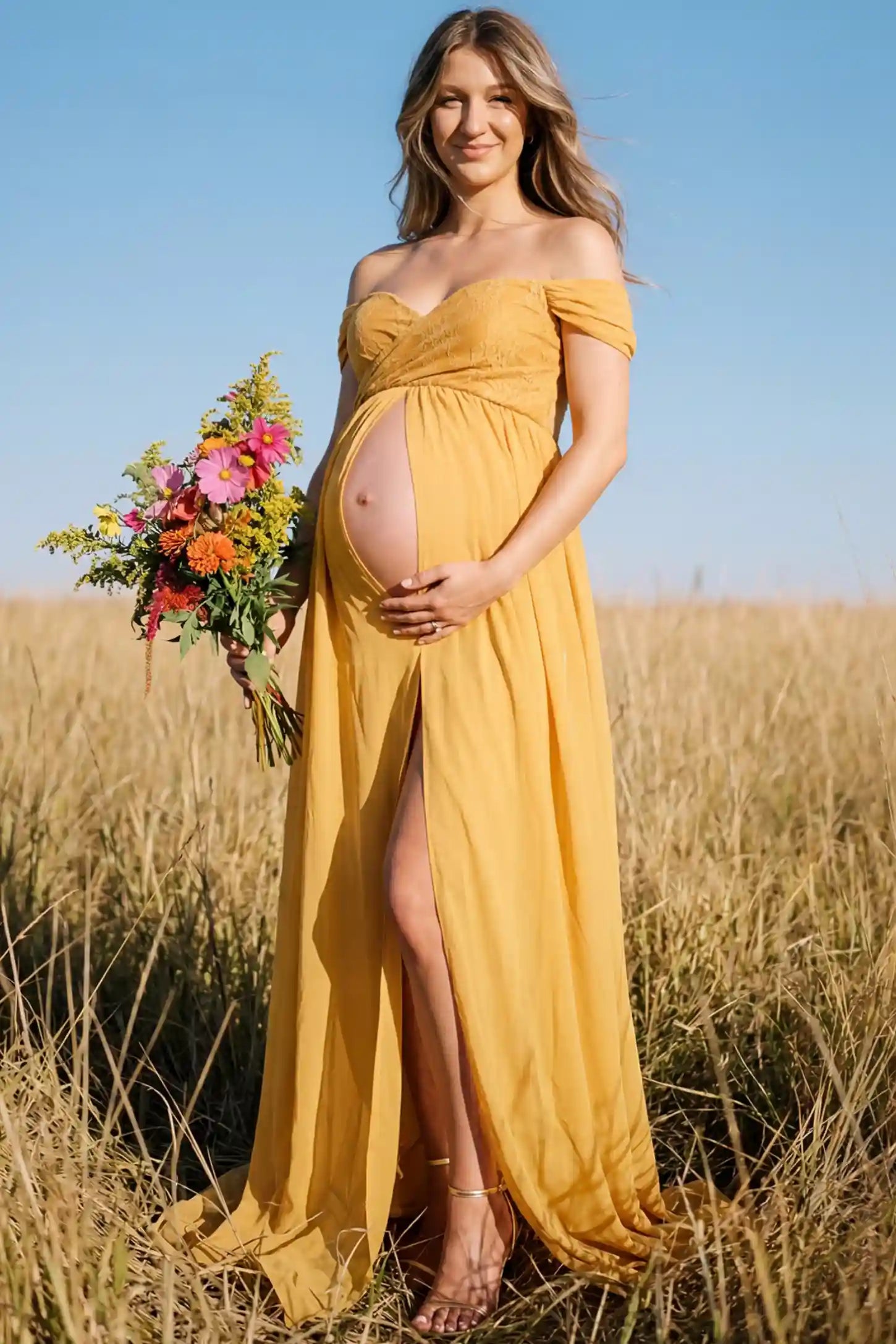 Lace Off Shoulder Slit Front Maternity Gown Lace Off Shoulder Slit Front Maternity Gown in Apricot Yellow featuring off shoulder and high slit front on a pregnant woman during outdoor photoshoot.