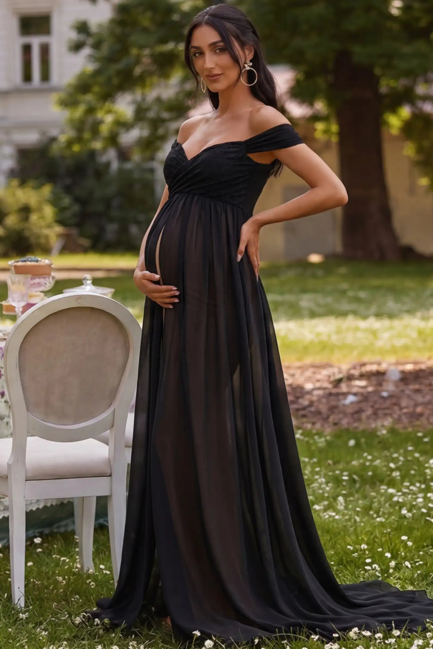 Lace Off Shoulder Slit Front Maternity Gown Lace Off Shoulder Slit Front Maternity Gown in Black featuring off shoulder and high slit front on a pregnant woman during outdoor photoshoot.
