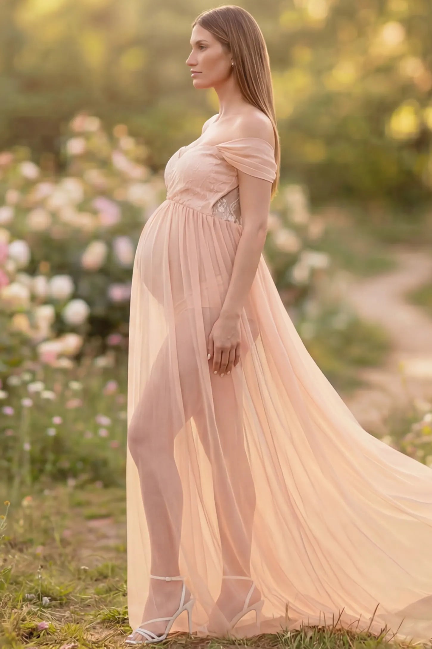 Lace Off Shoulder Slit Front Maternity Gown Lace Off Shoulder Slit Front Maternity Gown in Pink featuring off shoulder and flowy chiffon on a pregnant model showing side.