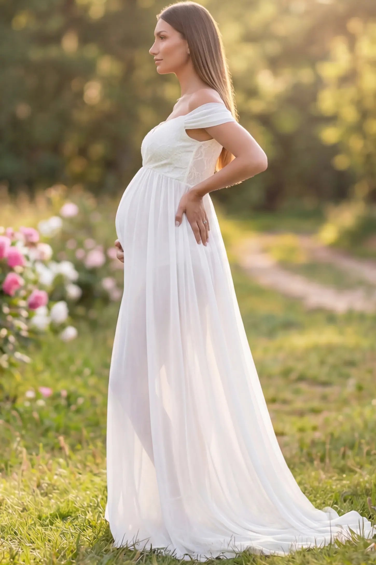 Lace Off Shoulder Slit Front Maternity Gown Lace Off Shoulder Slit Front Maternity Gown in White featuring off shoulder and flowy chiffon on a pregnant model showing side.