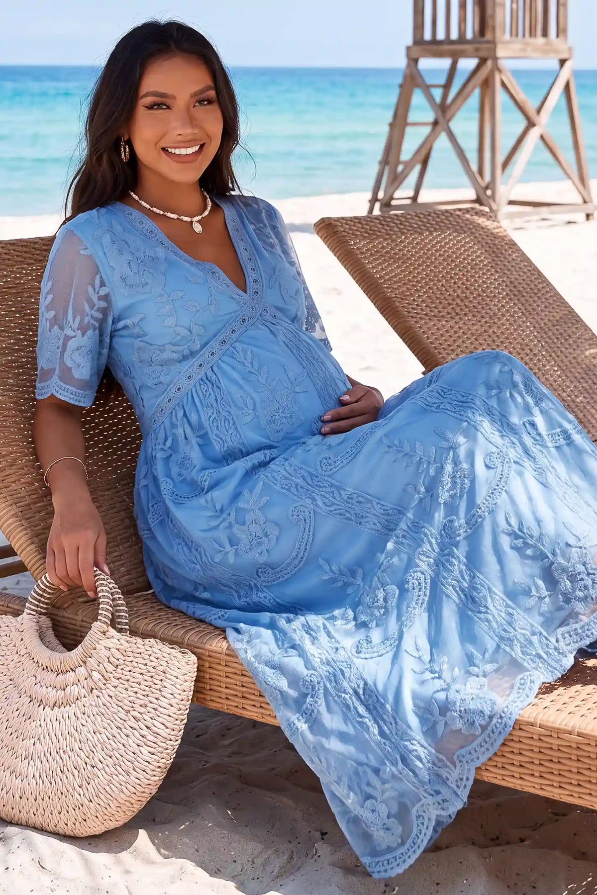 Lace Short Sheer Sleeve Maternity Maxi Dress Lace Short Sheer Sleeve Maternity Maxi Dress in Blue with delicate lace and sheer sleeves, lifestyle view on a pregnant model.