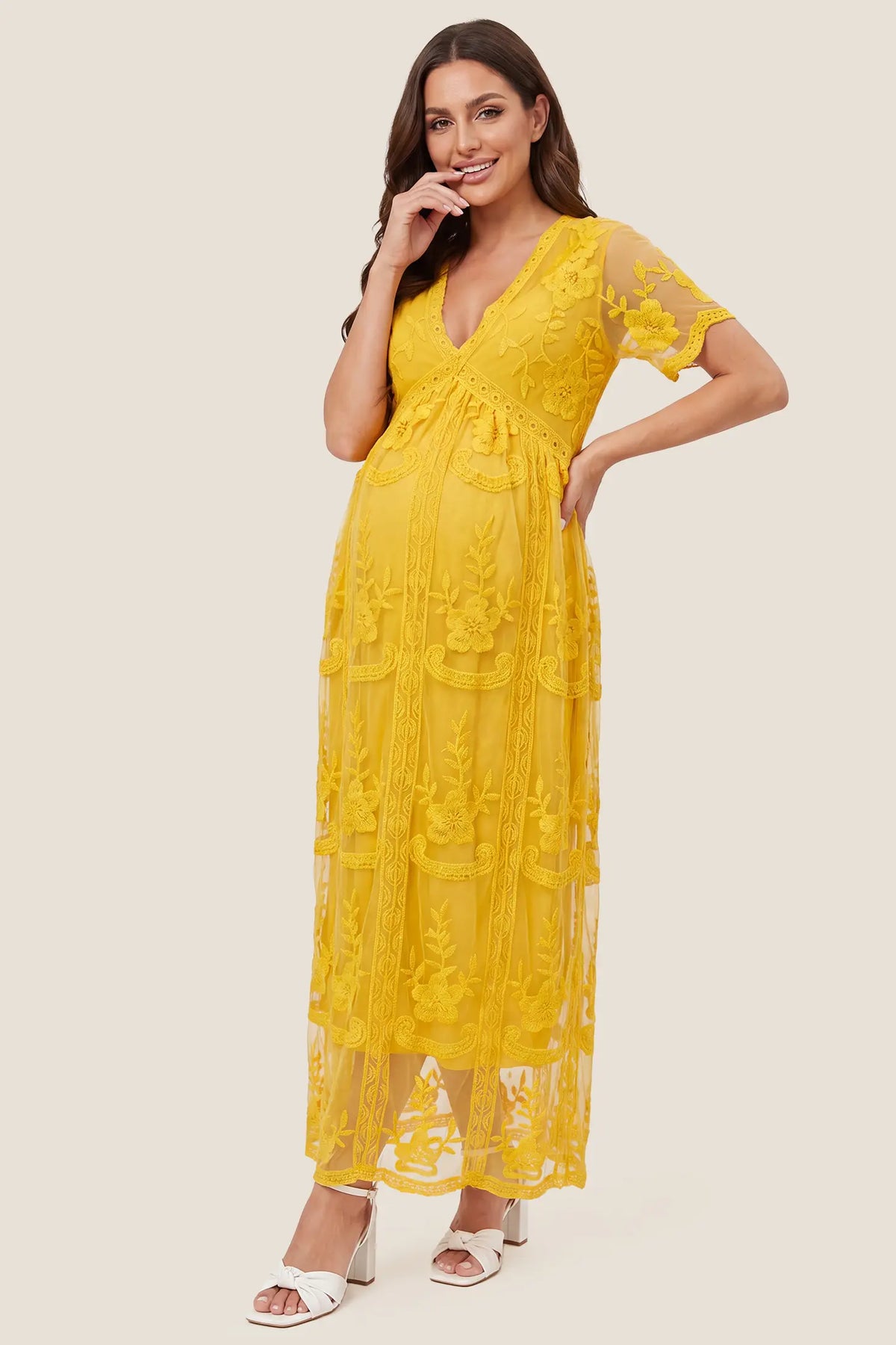 Lace Short Sheer Sleeve Maternity Maxi Dress Lace Short Sheer Sleeve Maternity Maxi Dress in Lemon Sorbet featuring short sheer sleeves and a floral lace overlay, front view on a pregnant model.