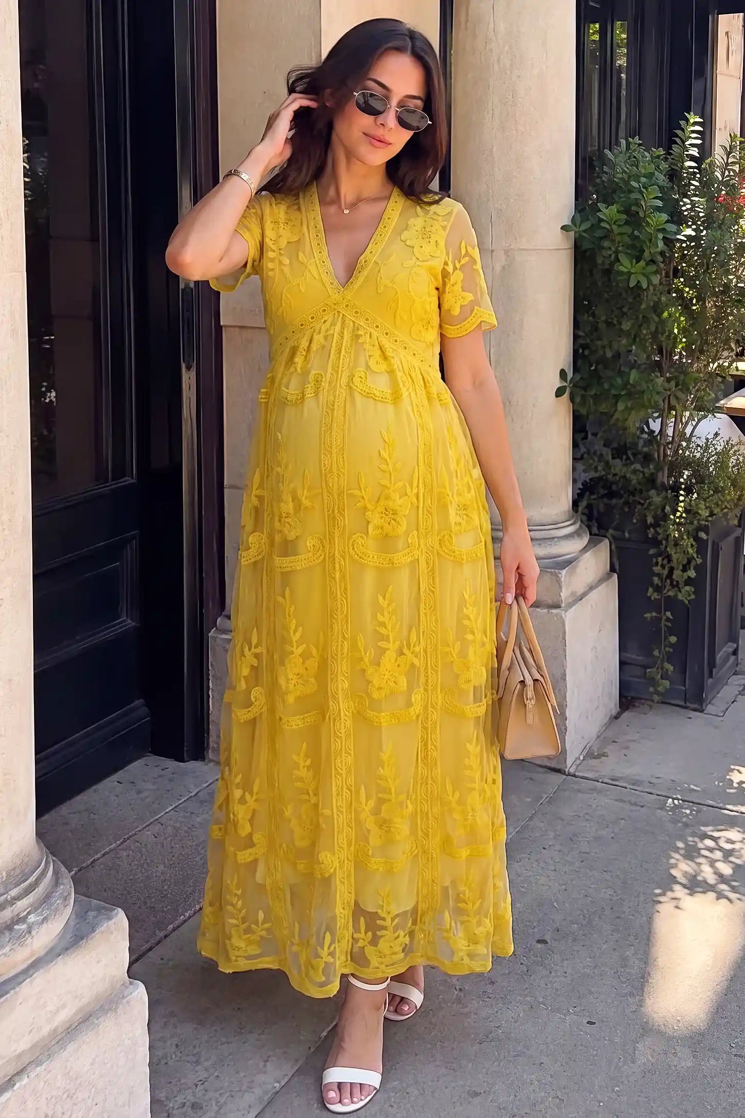 Lace Short Sheer Sleeve Maternity Maxi Dress Lace Short Sheer Sleeve Maternity Maxi Dress in Lemon Sorbet with elegant lace and sheer sleeve design, lifestyle front view on a pregnant model.