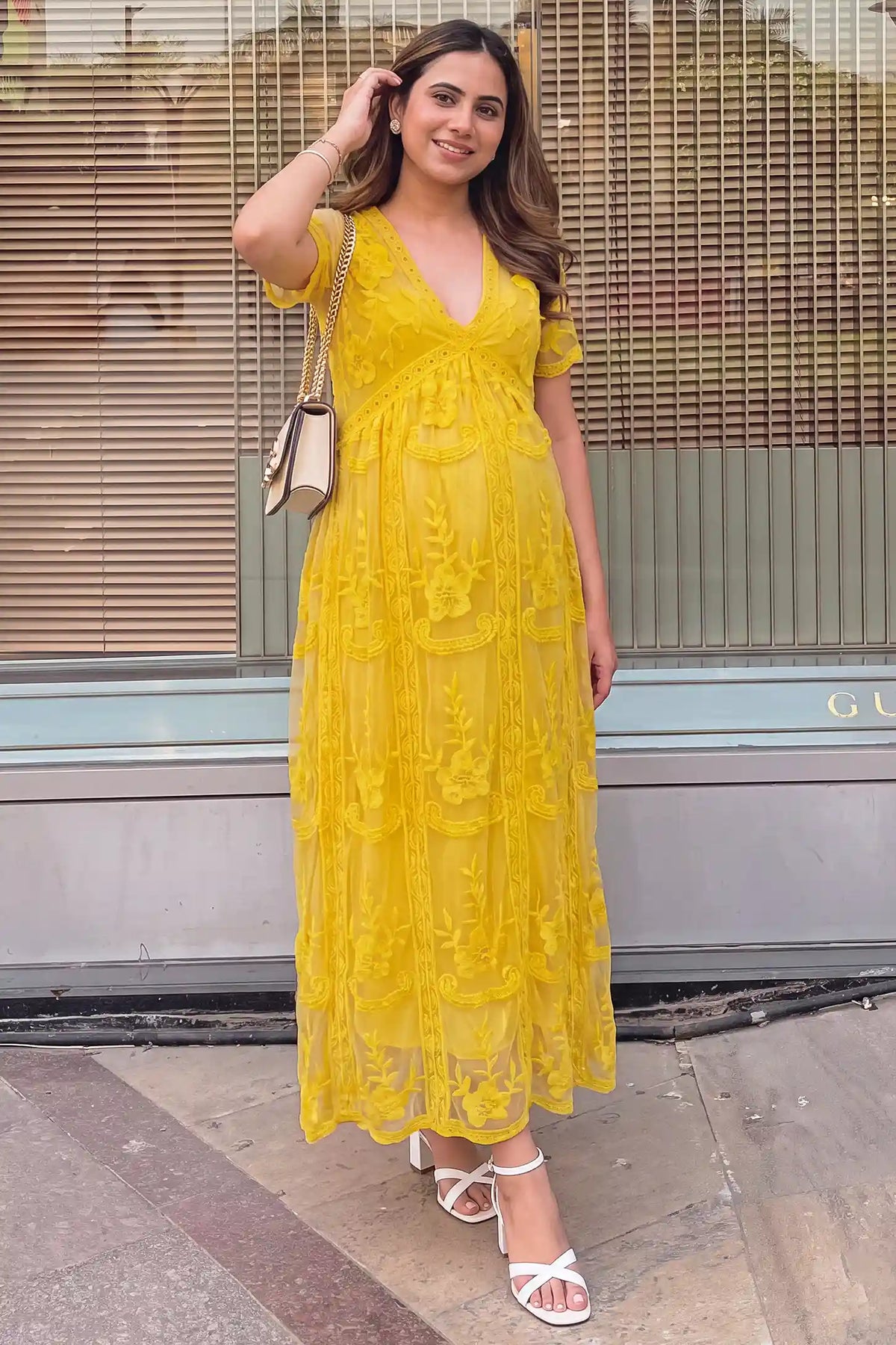 Lace Short Sheer Sleeve Maternity Maxi Dress Lace Short Sheer Sleeve Maternity Maxi Dress in Lemon Sorbet with elegant lace and sheer sleeve design, lifestyle front view on a pregnant model.