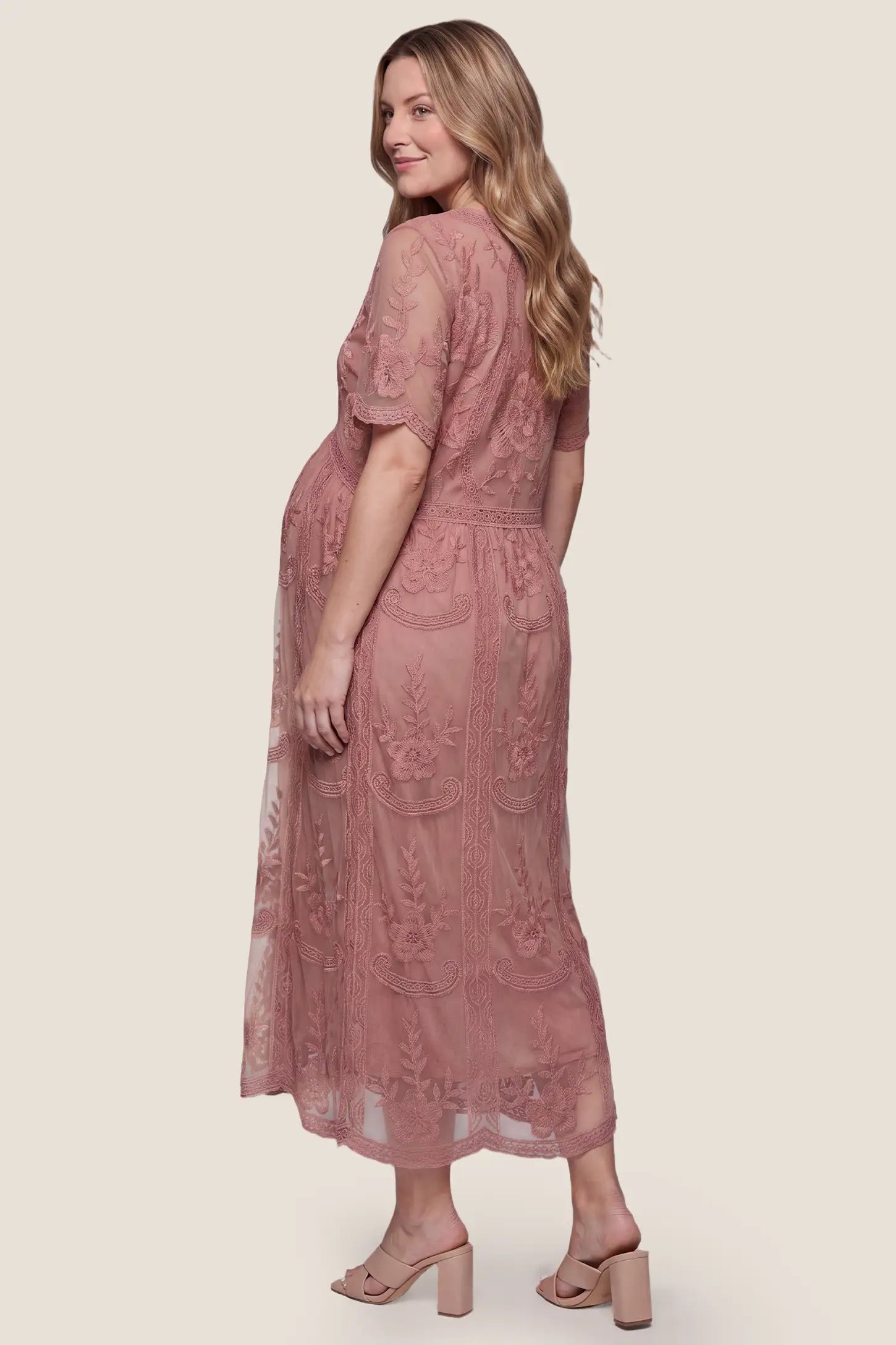 Lace Short Sheer Sleeve Maternity Maxi Dress Lace Short Sheer Sleeve Maternity Maxi Dress in Pink showcasing the beautiful back lace detail, back view on a pregnant model.