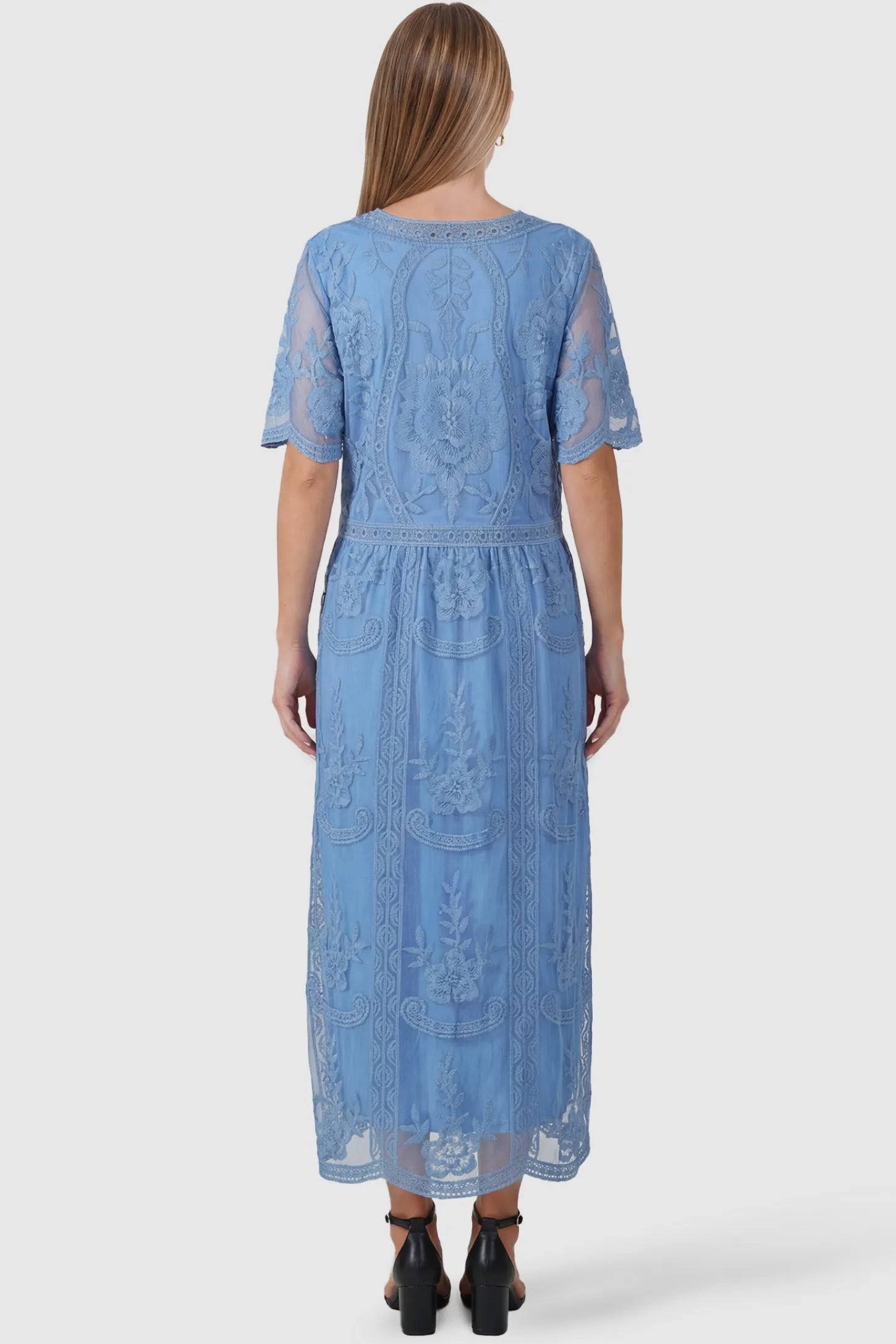 Lace Short Sheer Sleeve Maternity Maxi Dress Lace Short Sheer Sleeve Maternity Maxi Dress in blue featuring detailed embroidered mesh on a pregnant model, back view.