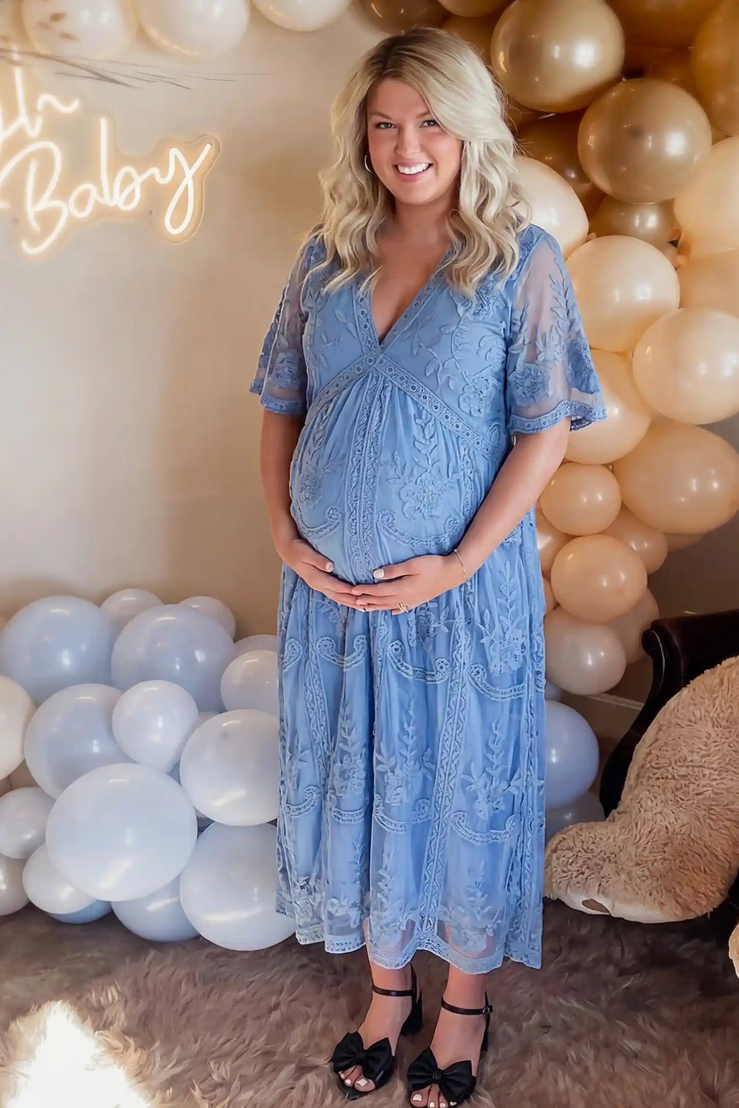 Lace Short Sheer Sleeve Maternity Maxi Dress Lace Short Sheer Sleeve Maternity Maxi Dress in blue featuring elegant floral embroidery on a pregnant model, front view.